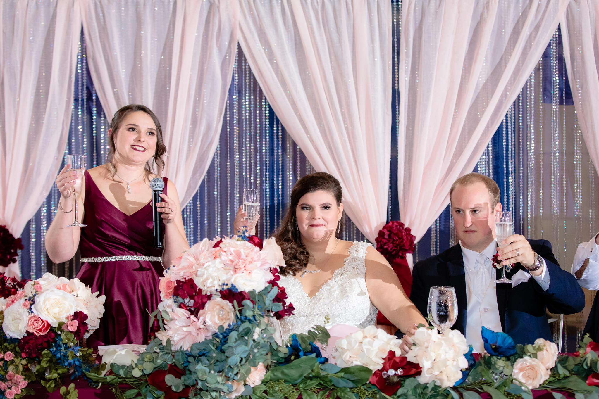 The maid of honor leads a toast for the bride and groom at the Pennsylvanian