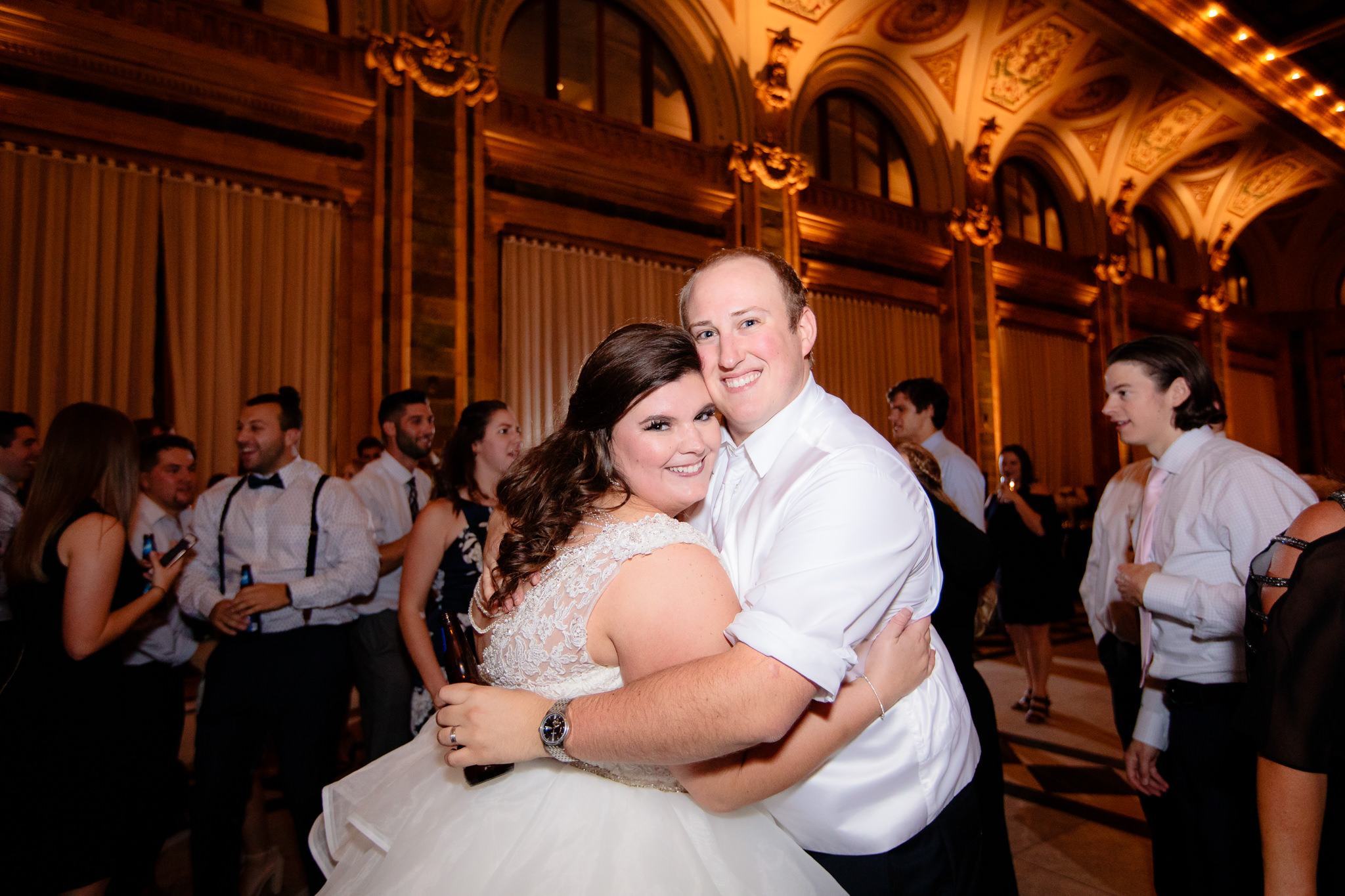 Bride and groom pose for a picture on the dancefloor of The Pennsylvanian