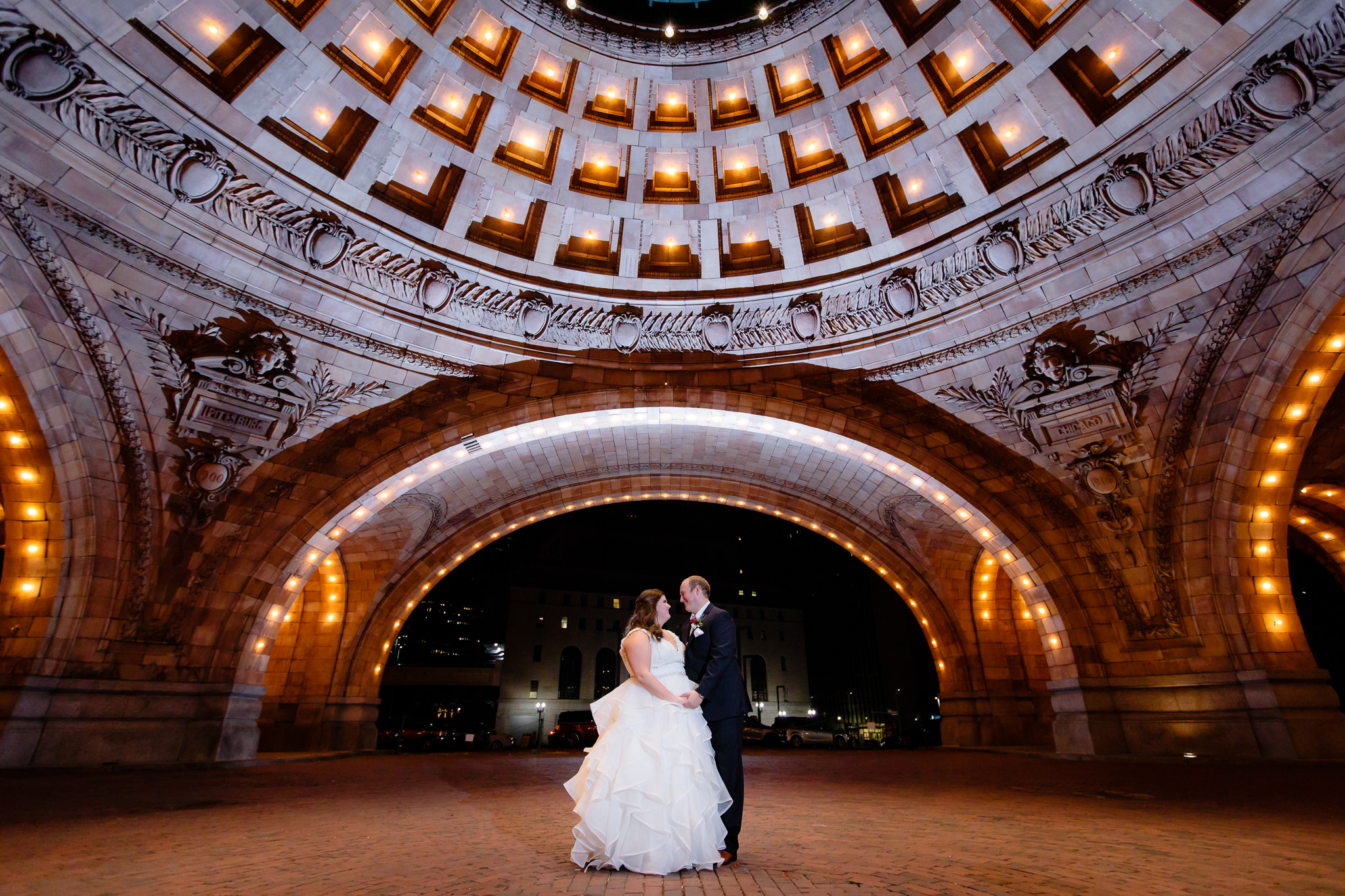 Nighttime shot of the bride and groom outside of The Pennsylvanian