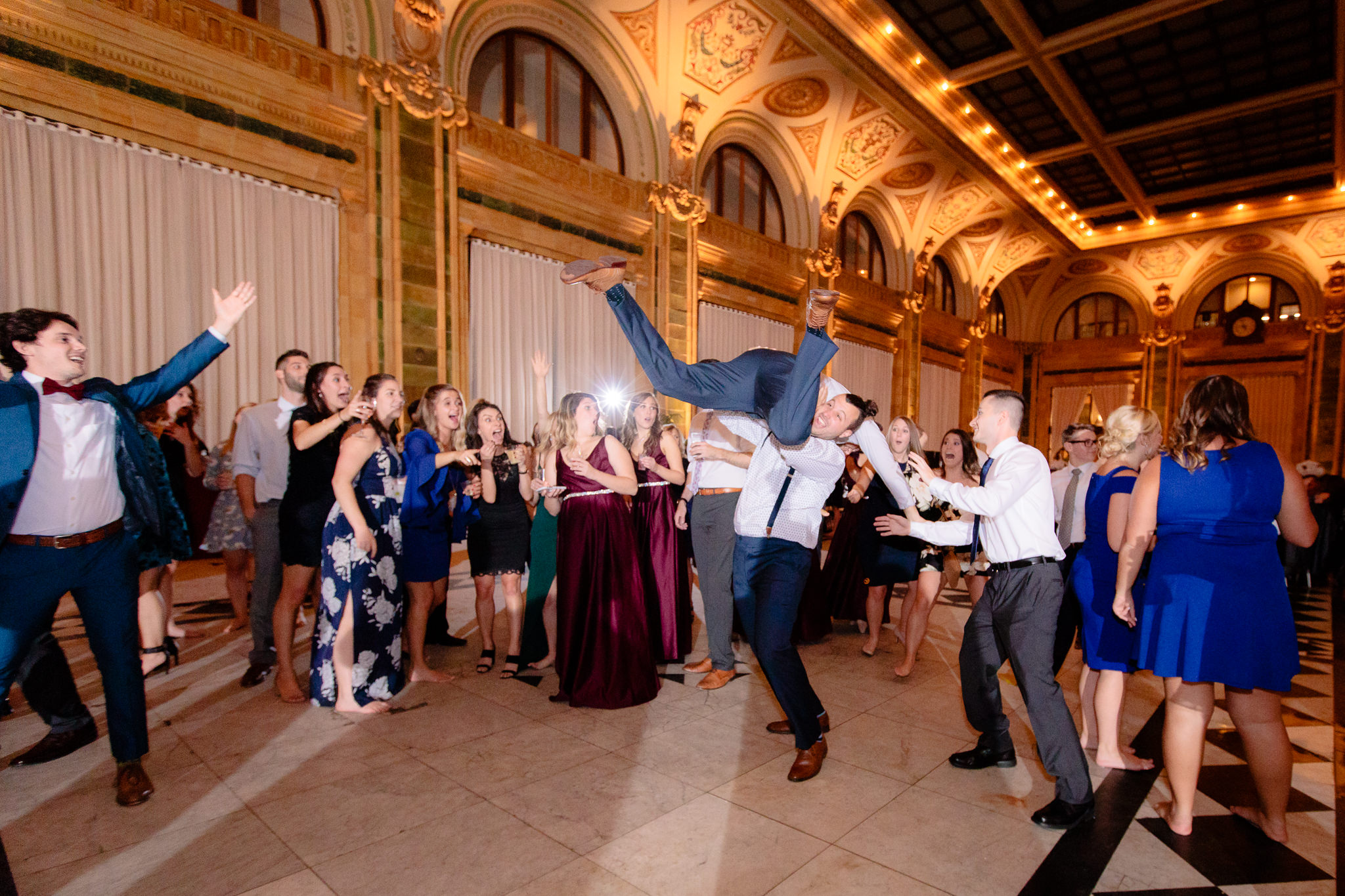 Wedding goers dance at a reception at the Pennsylvanian