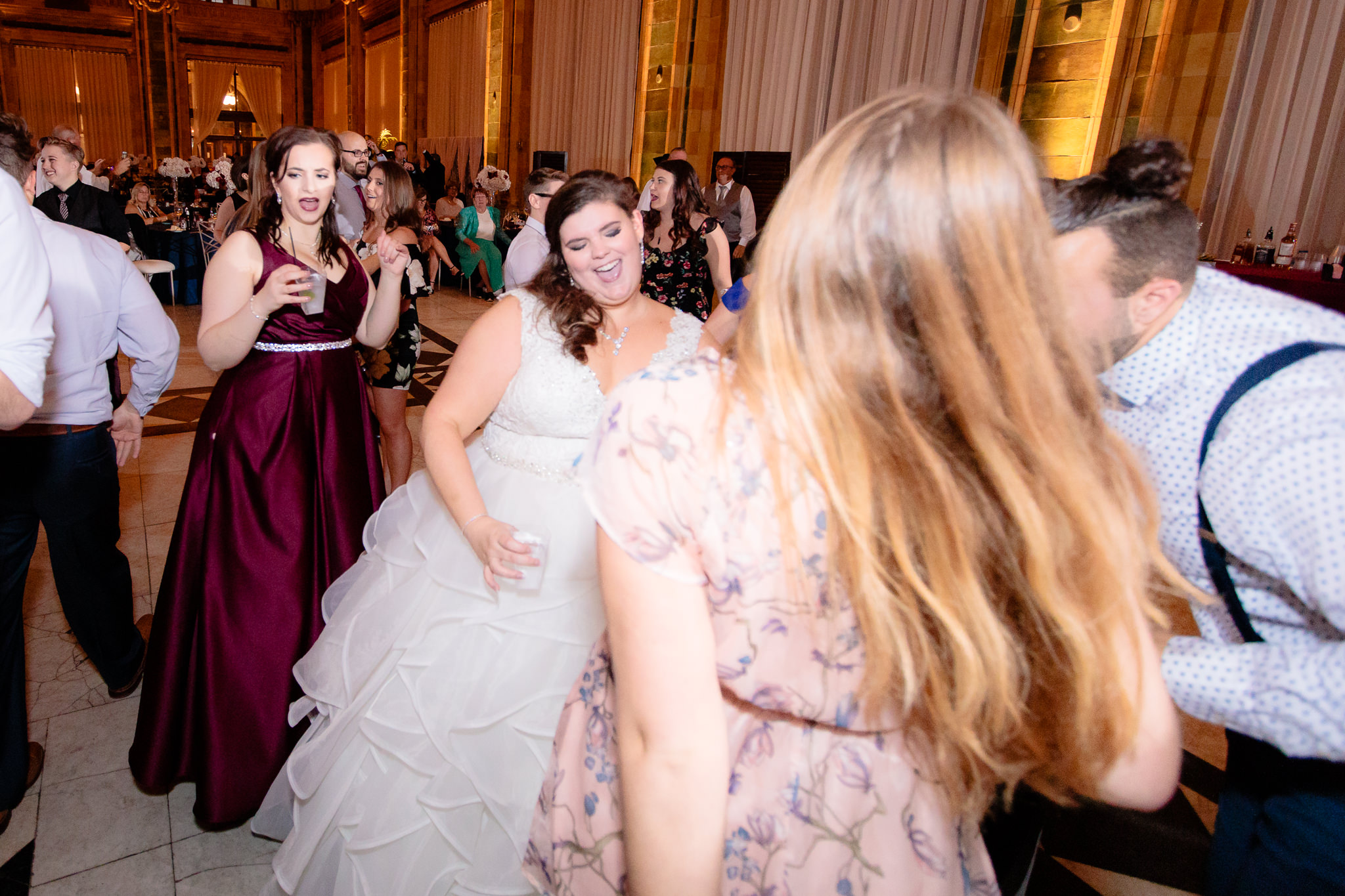 Bride dancing with friends at the reception at a wedding at the Pennsylvanian