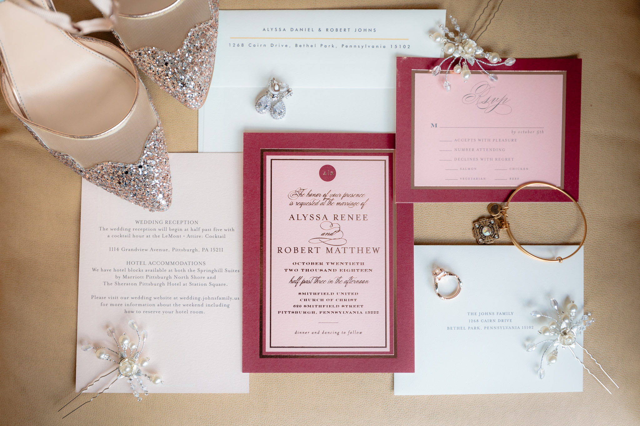 Burgundy & pink wedding invitations by Minted with bride's gold shoes and jewelry