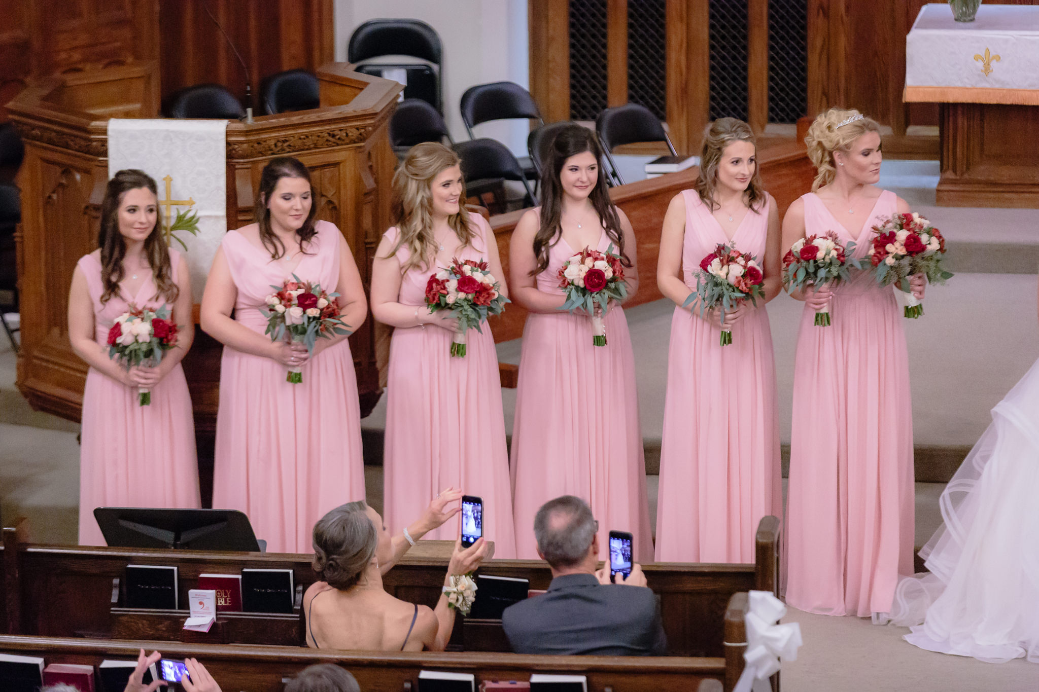 Bridesmaids during a wedding ceremony at Smithfield United Church of Christ