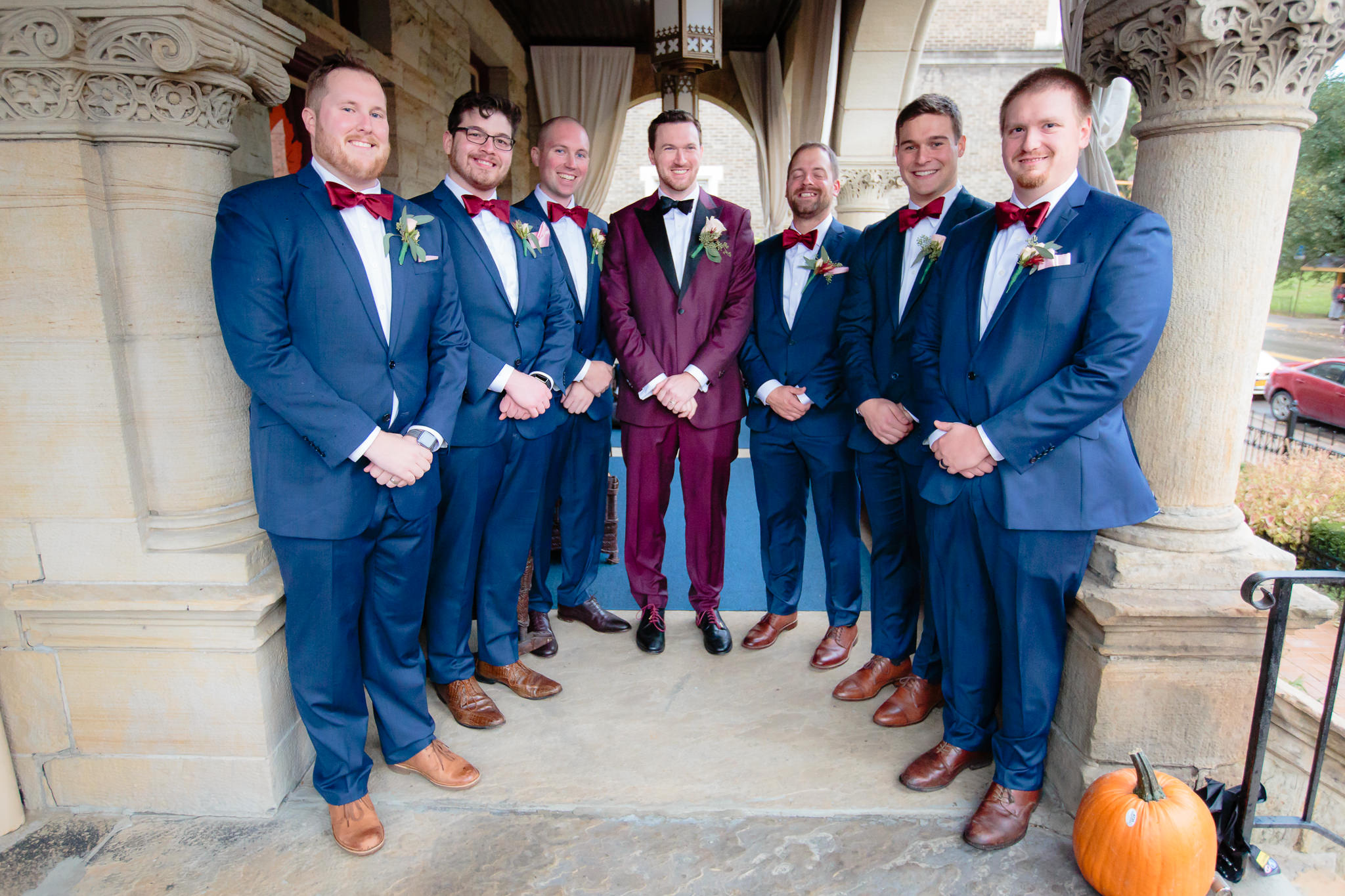 Groomsmen in navy tuxes from Surmesur before a LeMont wedding reception