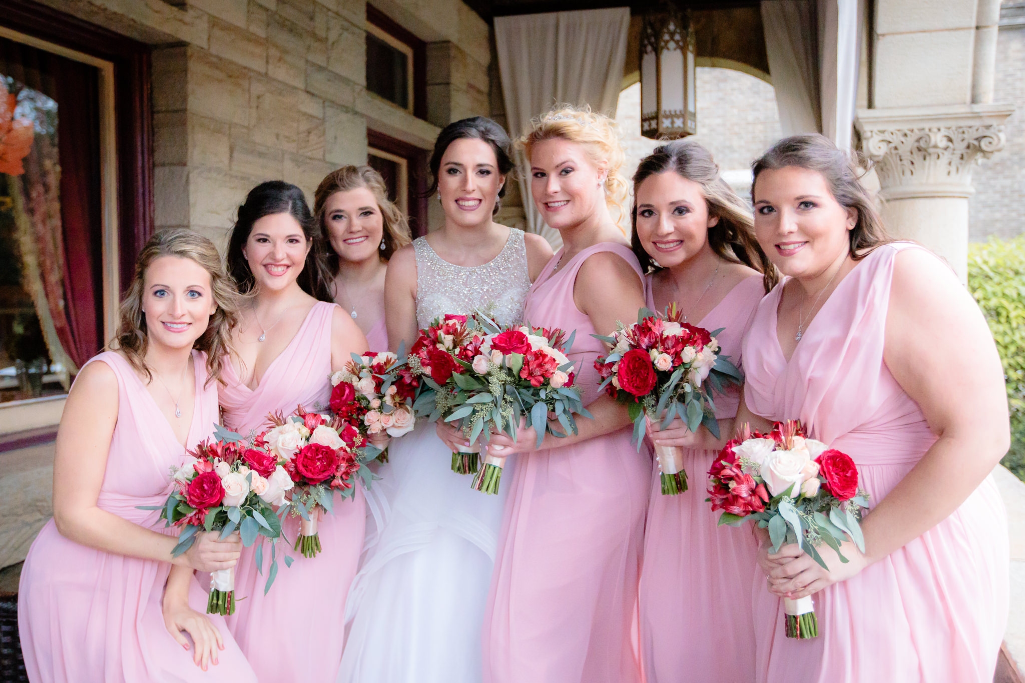 Bridesmaids in pink dresses from the Dessy Group before a LeMont wedding