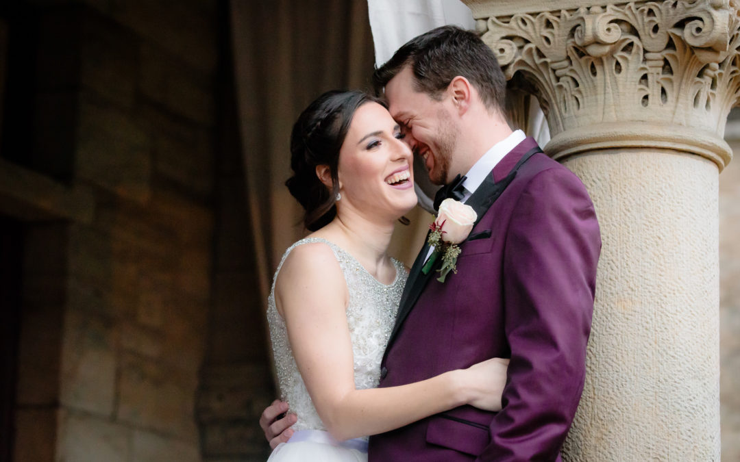Bride and groom snuggle together and laugh during portraits on the North Side of Pittsburgh