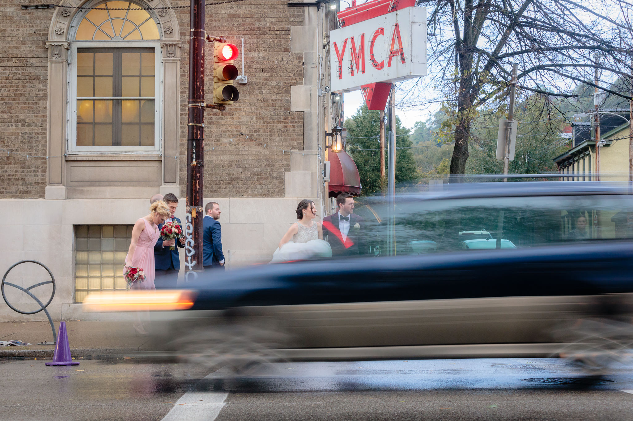 Newlyweds wait to cross the street to Allegheny Commons Park before their LeMont wedding