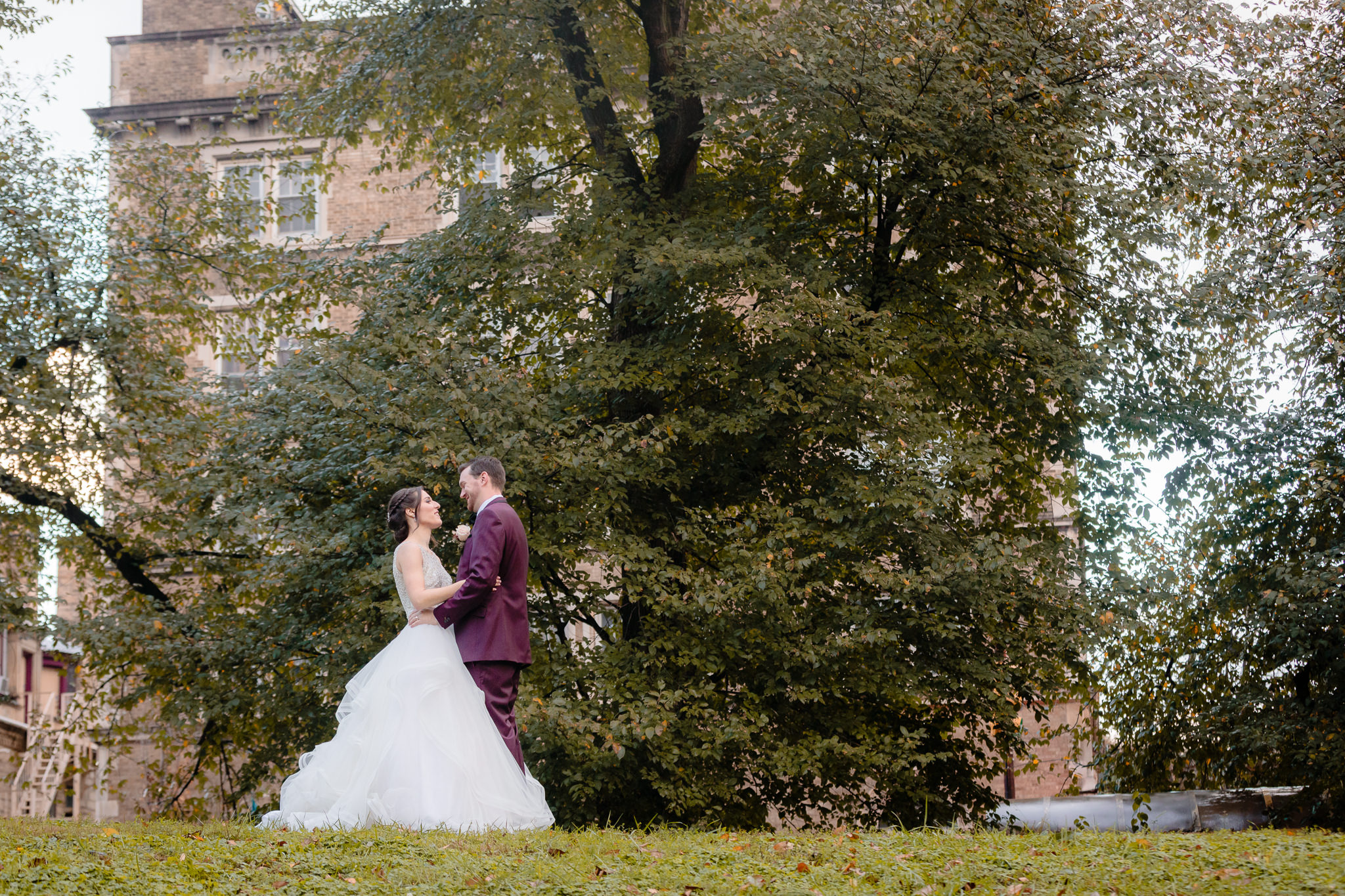 Bride & groom dance on a hilltop at Allegheny Commons Park in Pittsburgh