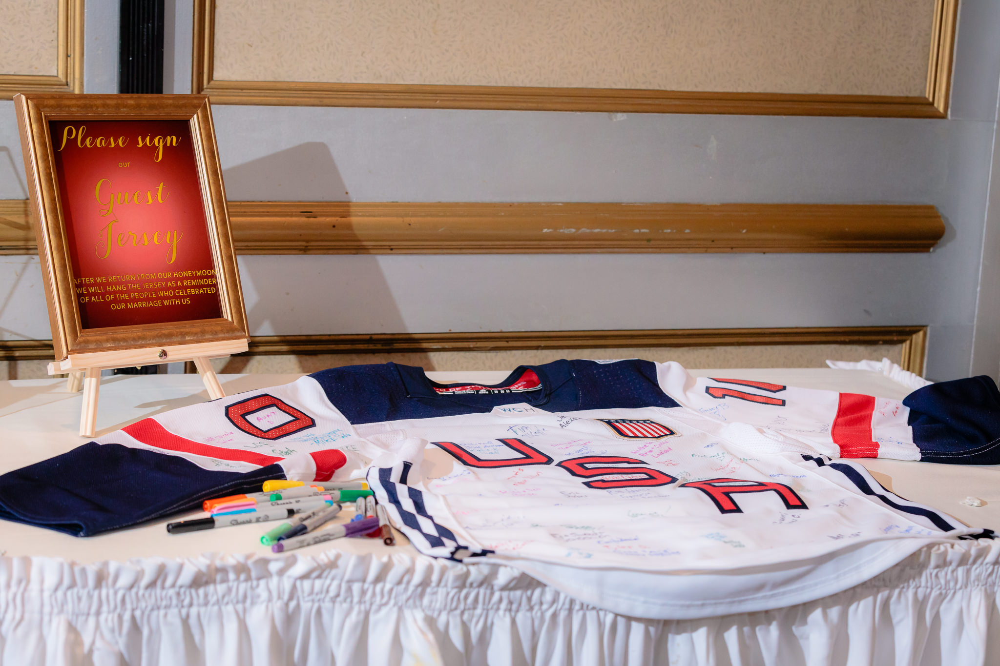 USA hockey jersey as a guestbook at a LeMont wedding reception