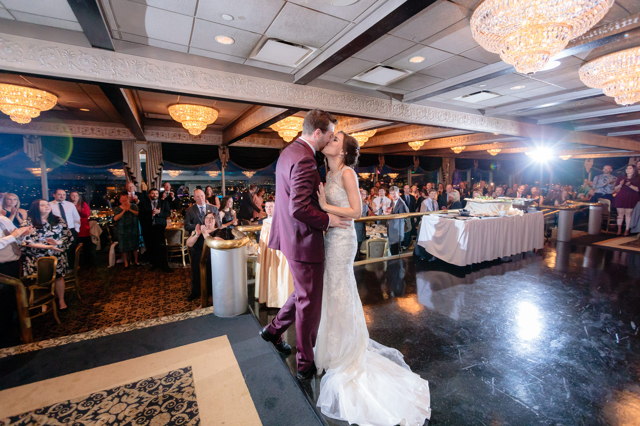 Newlyweds kiss on the dance floor after being introduced at their LeMont wedding