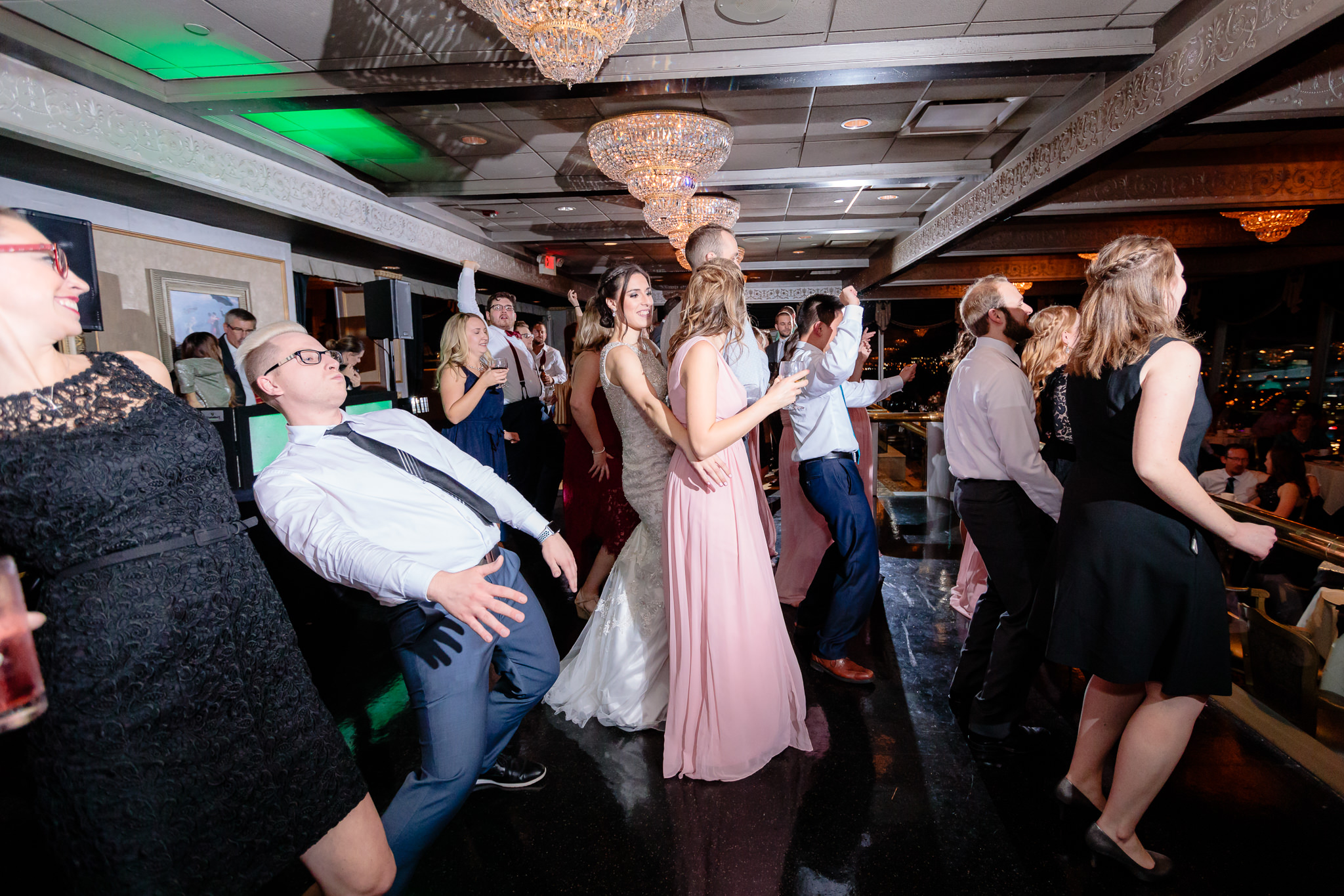 Bride dances with guests at her LeMont wedding