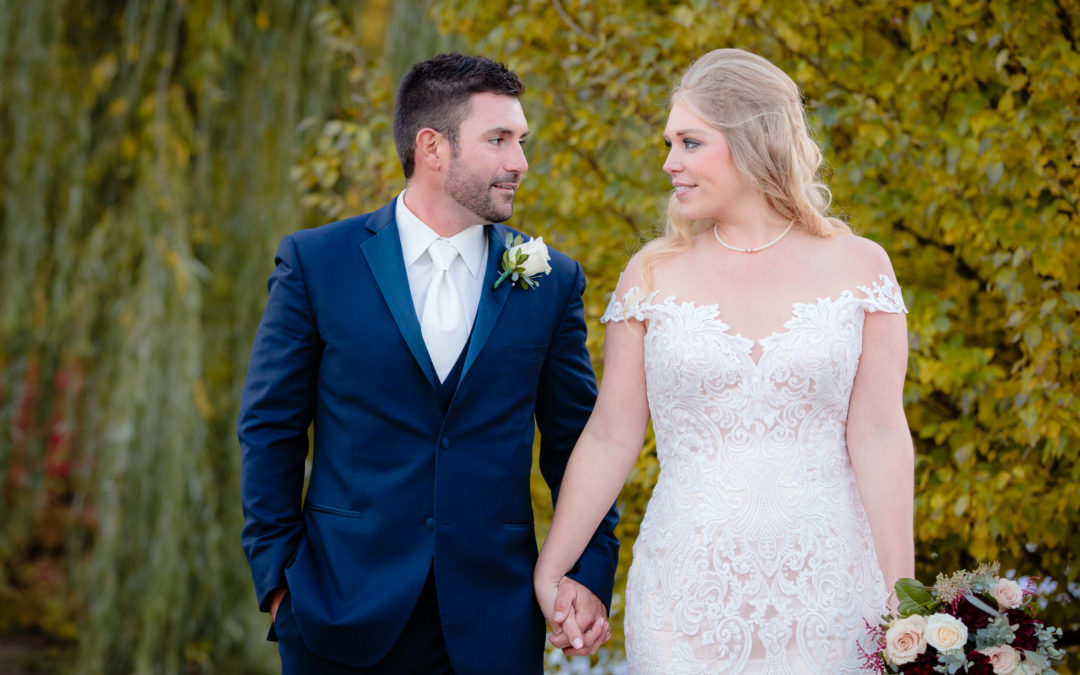 Bride and groom walk together to their Riverside Landing wedding reception