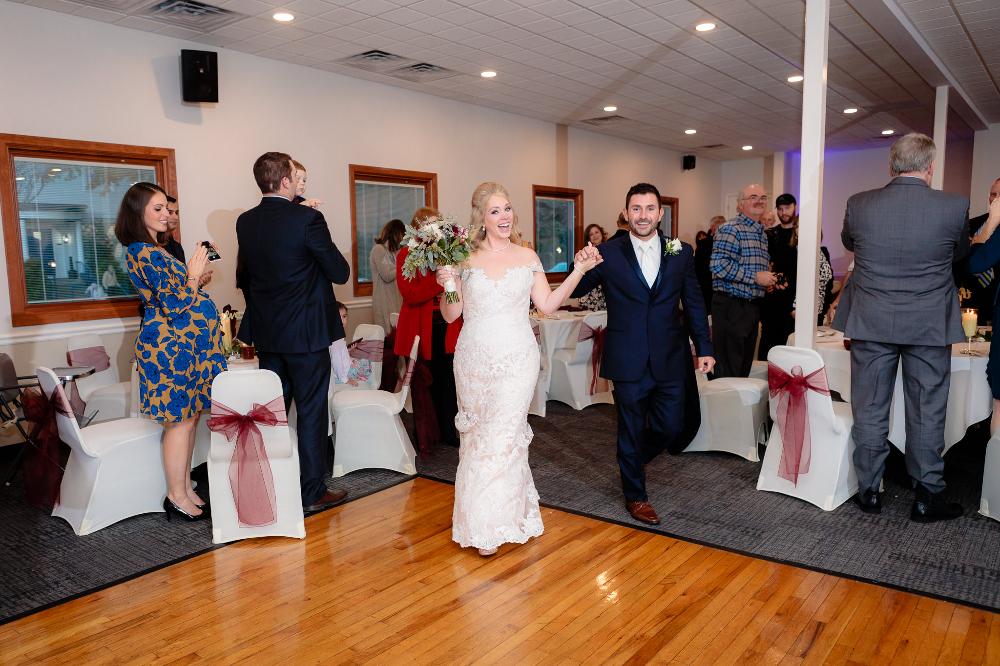 Newlyweds enter their wedding reception at Riverside Landing