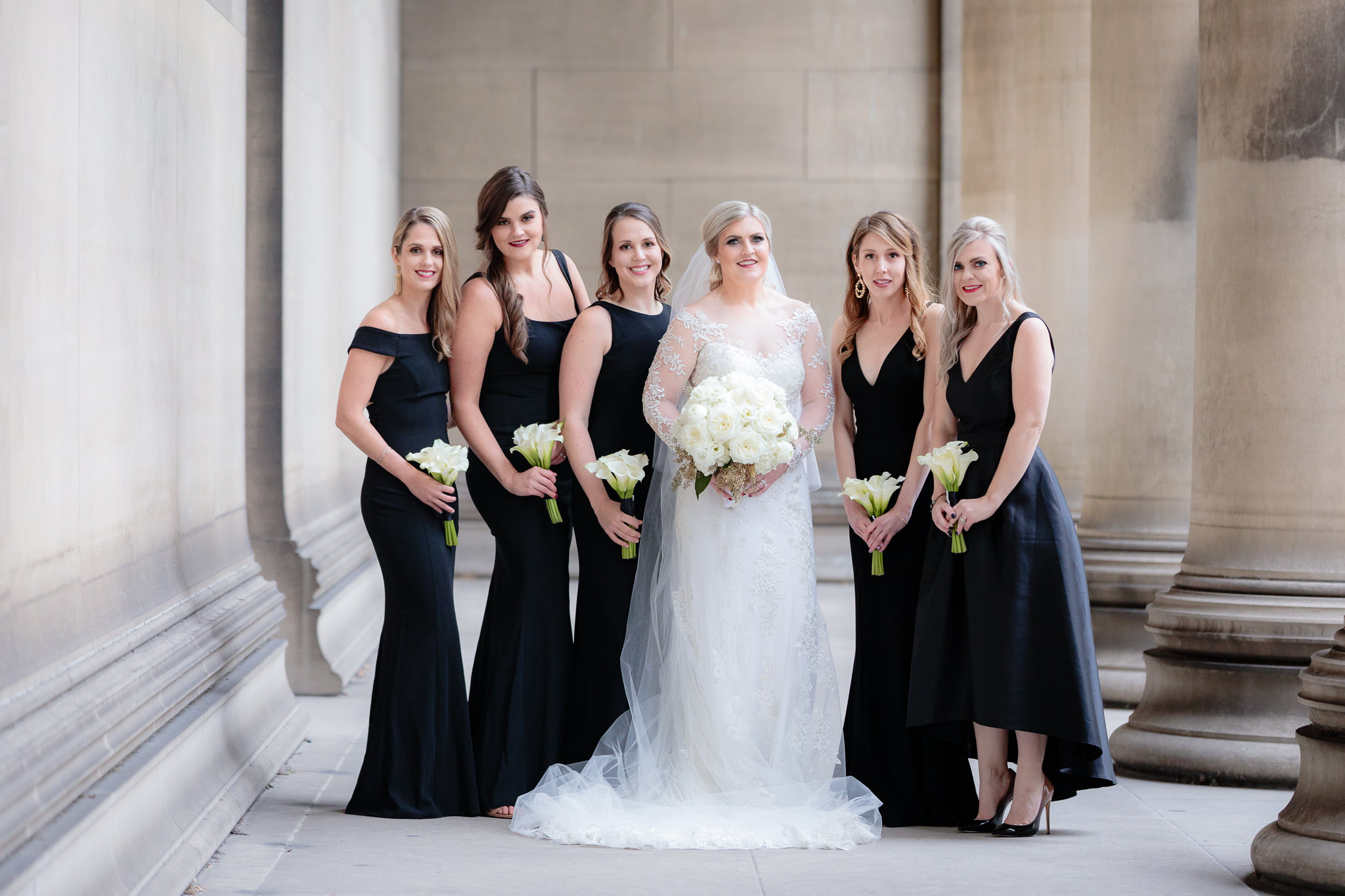 Bride & bridesmaids in classic black dresses before a Soldiers & Sailors wedding