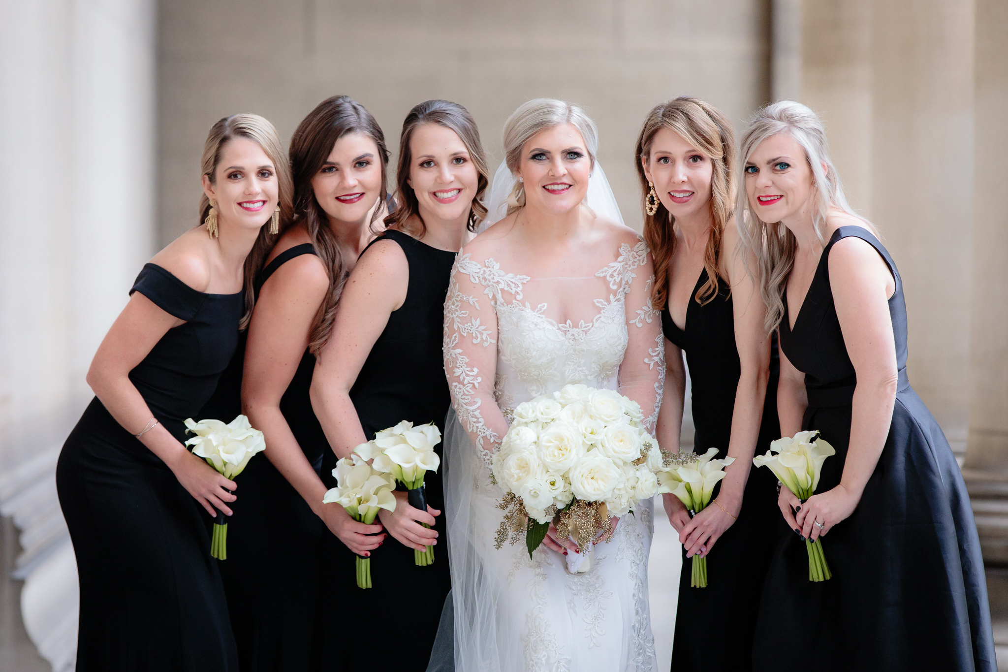 Bridesmaids in black with the bride before her Soldiers & Sailors wedding