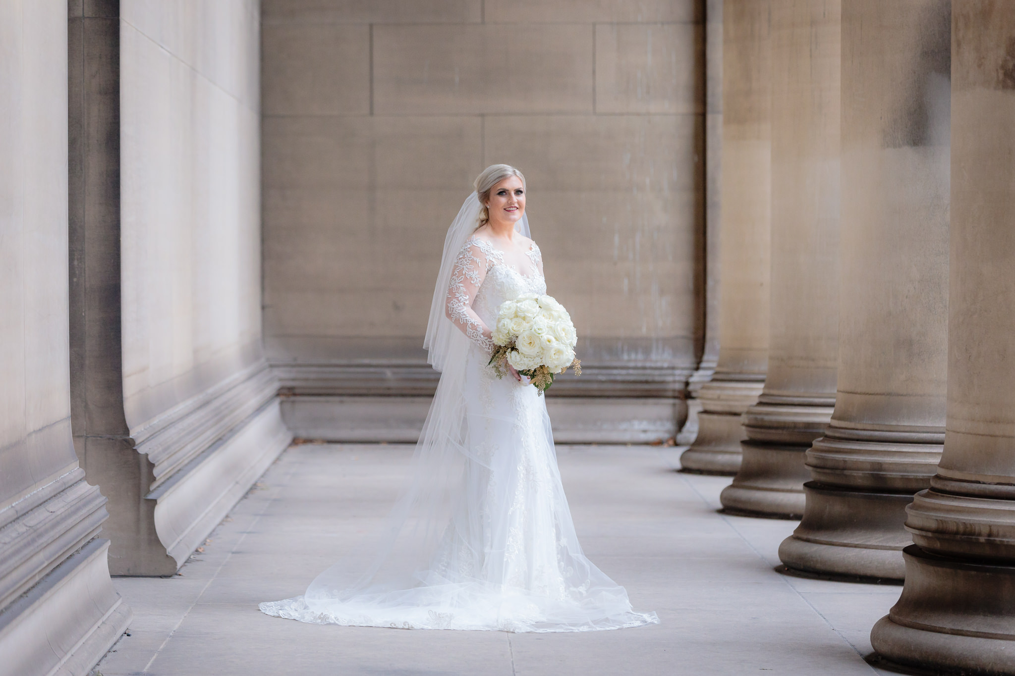 Bridal portrait at CMU columns with a Sottero & Midgley dress from Sorelle Bridal and bouquet by Hearts & Flowers