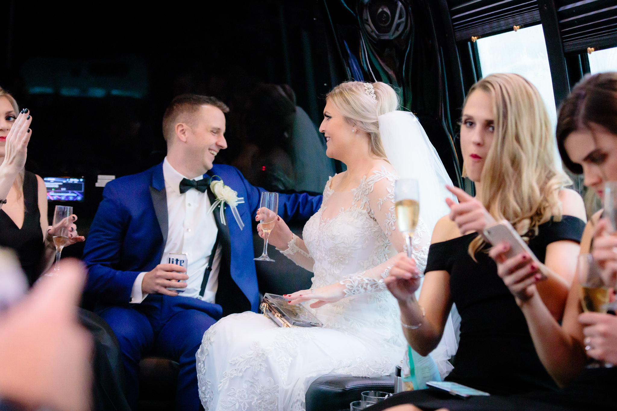 Newlyweds laugh together on the limo ride to Soldiers & Sailors