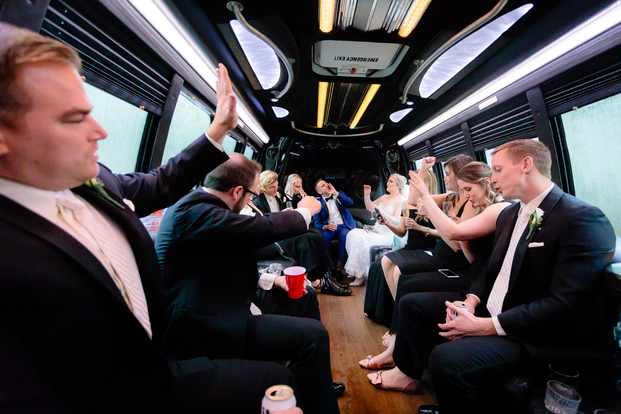 Bridal party sings on the limo ride to a Soldiers & Sailors wedding