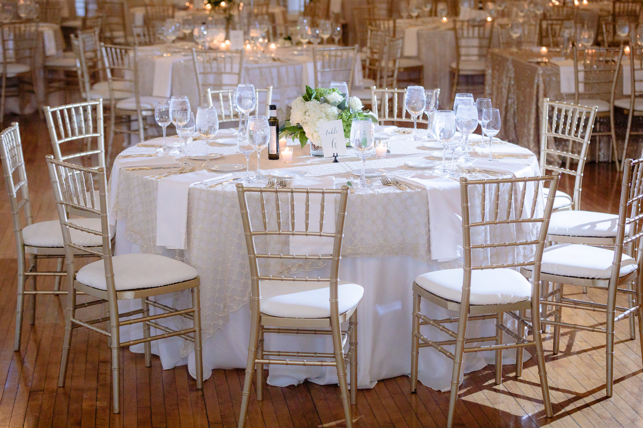 Classic white and gold table settings for a wedding reception at Soldiers & Sailors