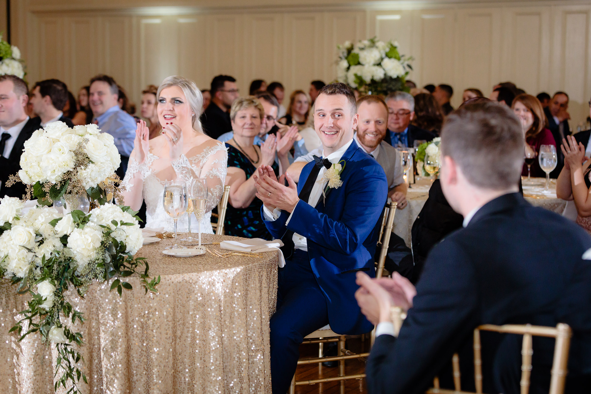 Bride & groom clap during speeches at a Soldiers & Sailors wedding