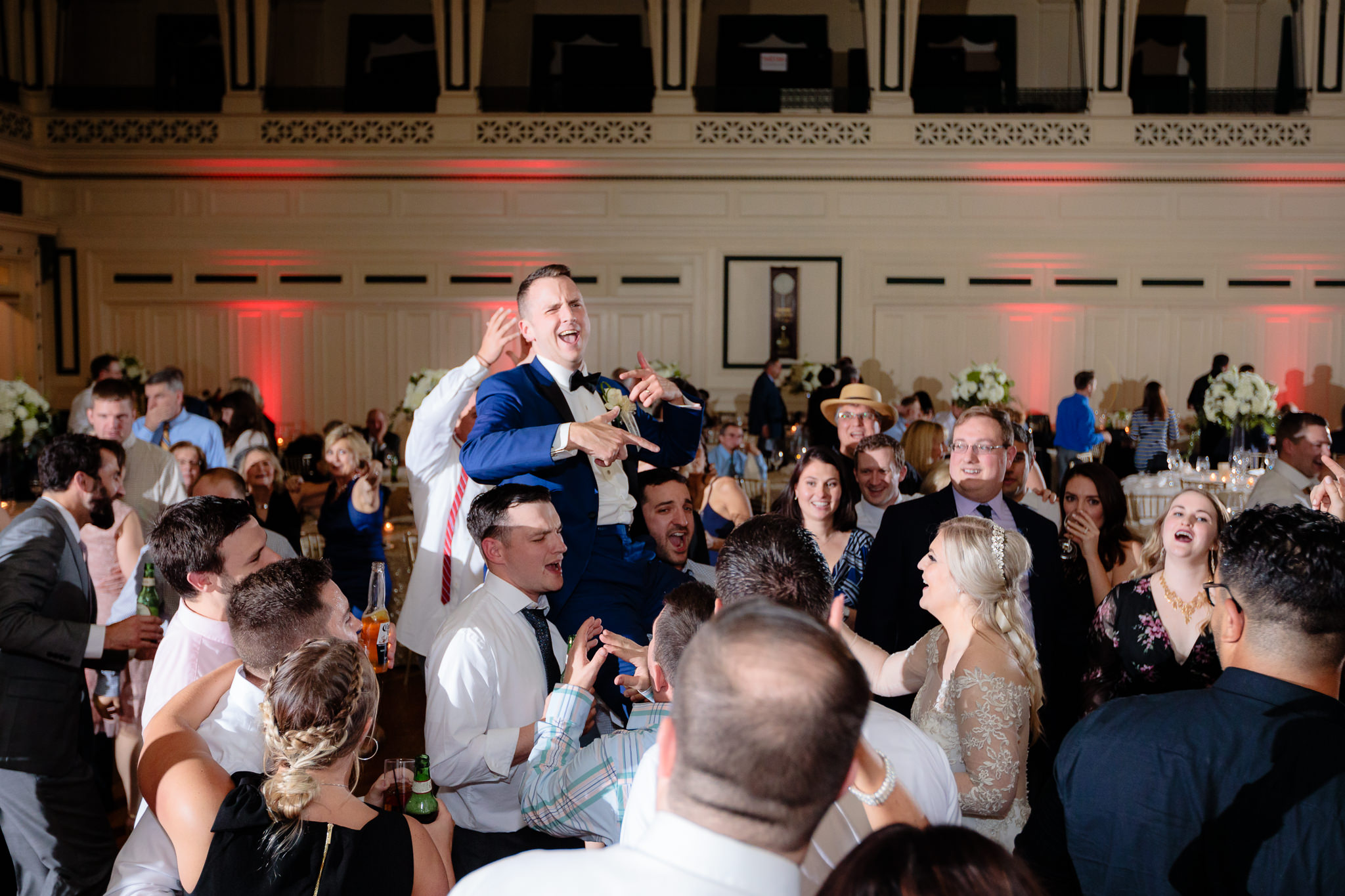 Guests lift the groom on their shoulders at Soldiers & Sailors Memorial Hall