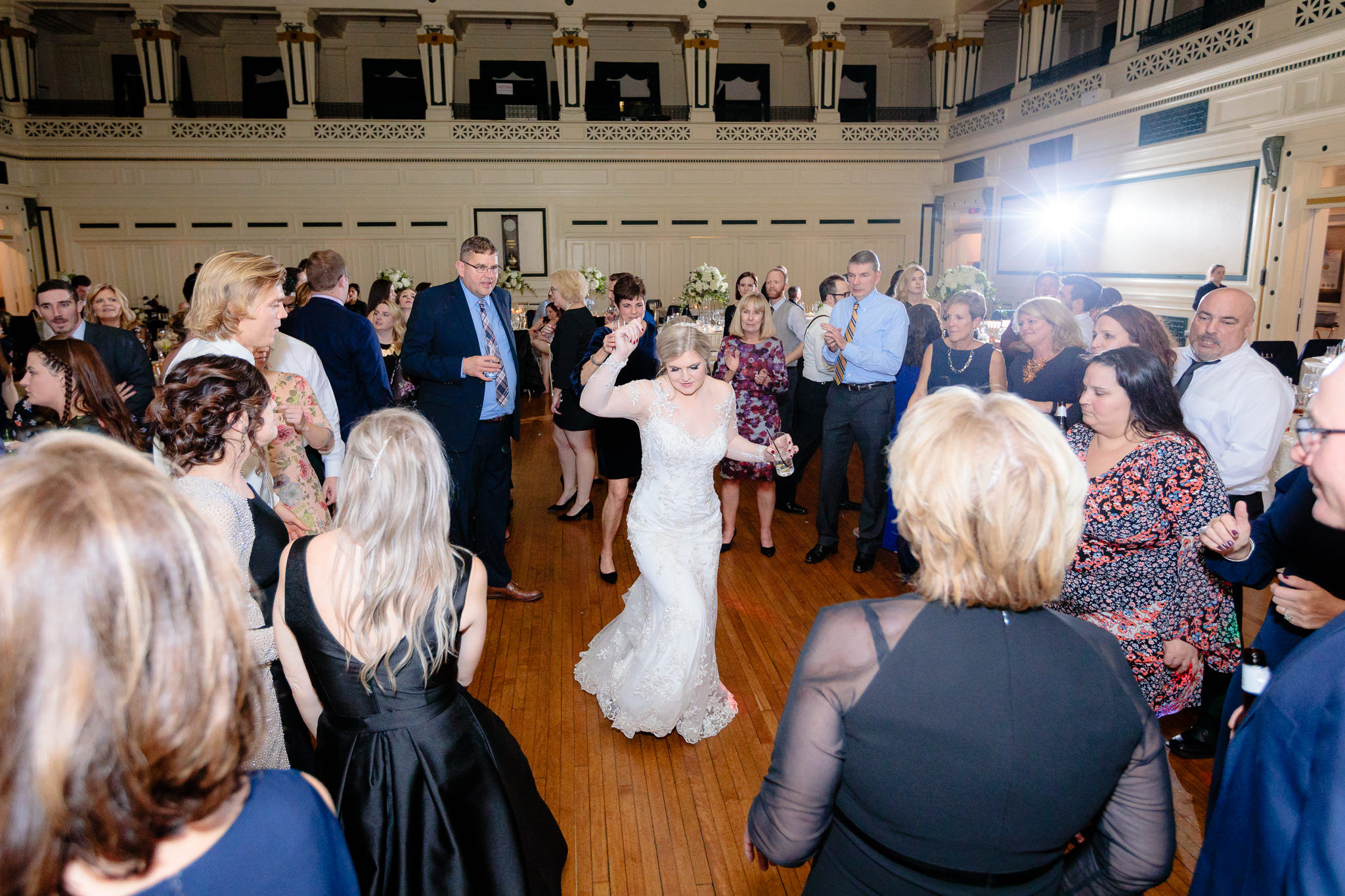 Bride dances in a circle of guests at Soldiers & Sailors