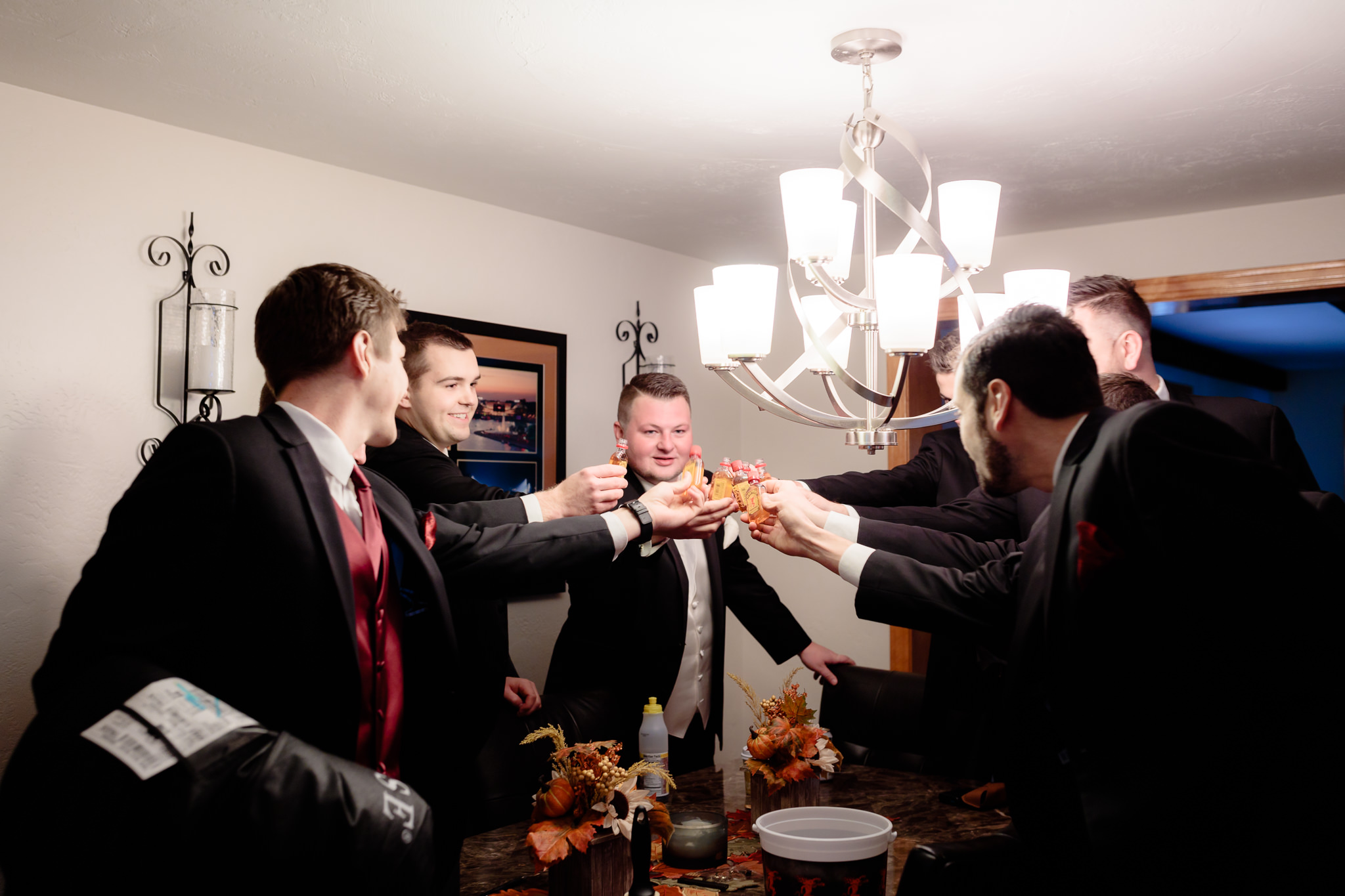 Groom toasts his groomsmen with Fireball whiskey before his wedding at St. Malachy in Kennedy Township