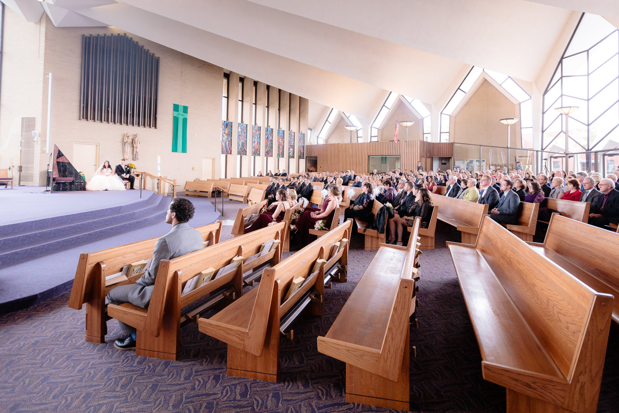 Guests in the pews at St. Malachy during a wedding ceremony