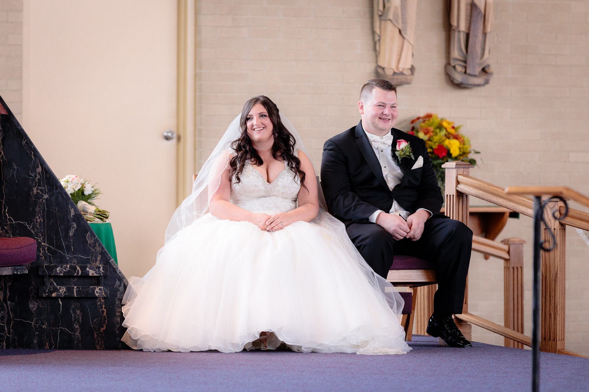 Bride & groom laugh during their St. Malachy wedding ceremony