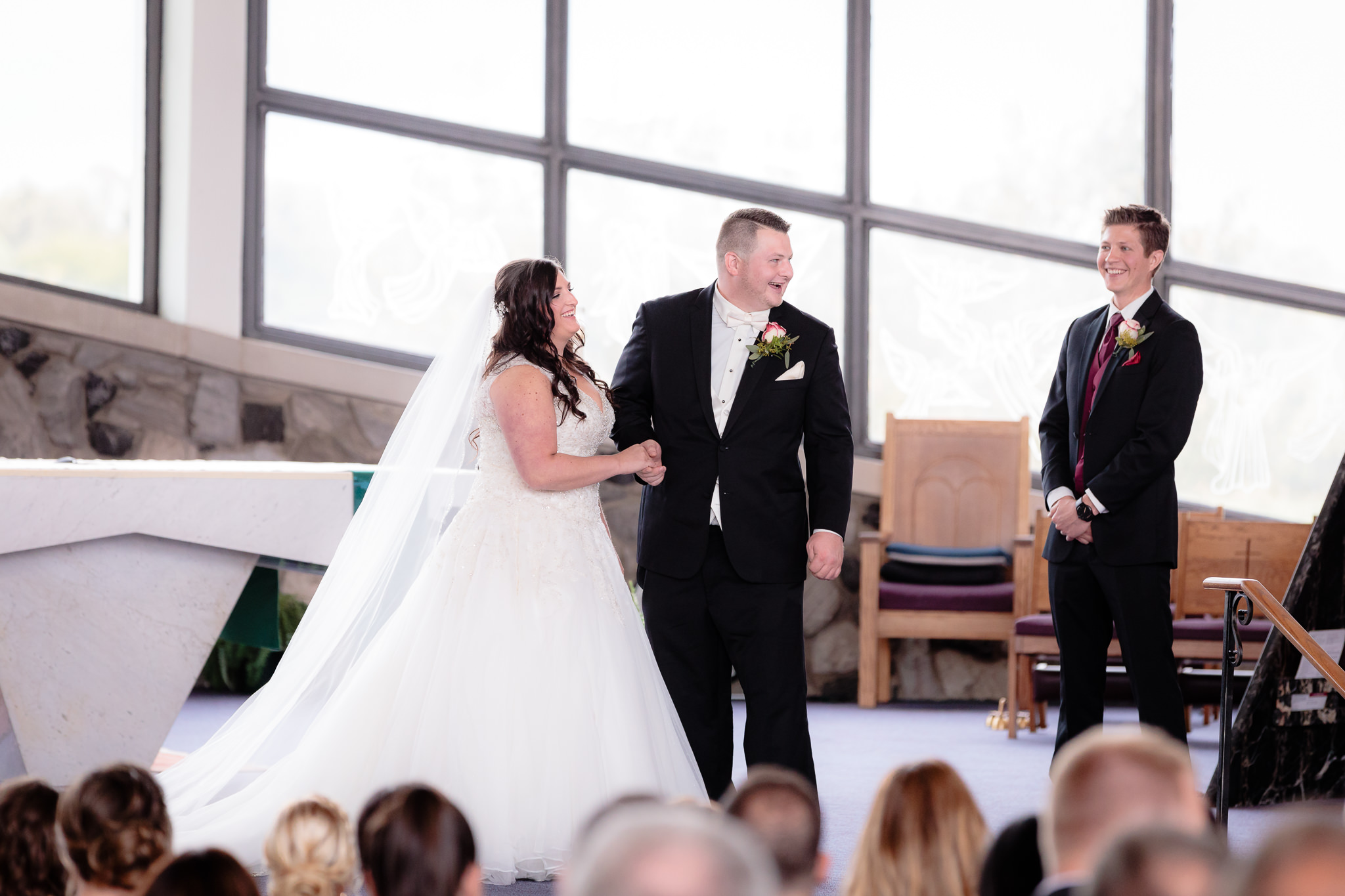 Groom laughs after almost kissing his bride too soon at St. Malachy