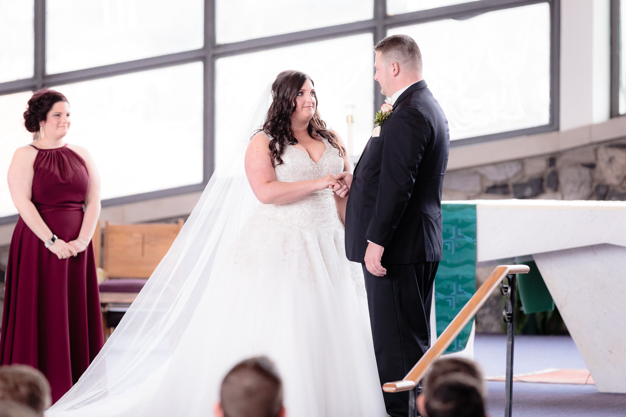 Bride looks at the groom during vows at St. Malachy