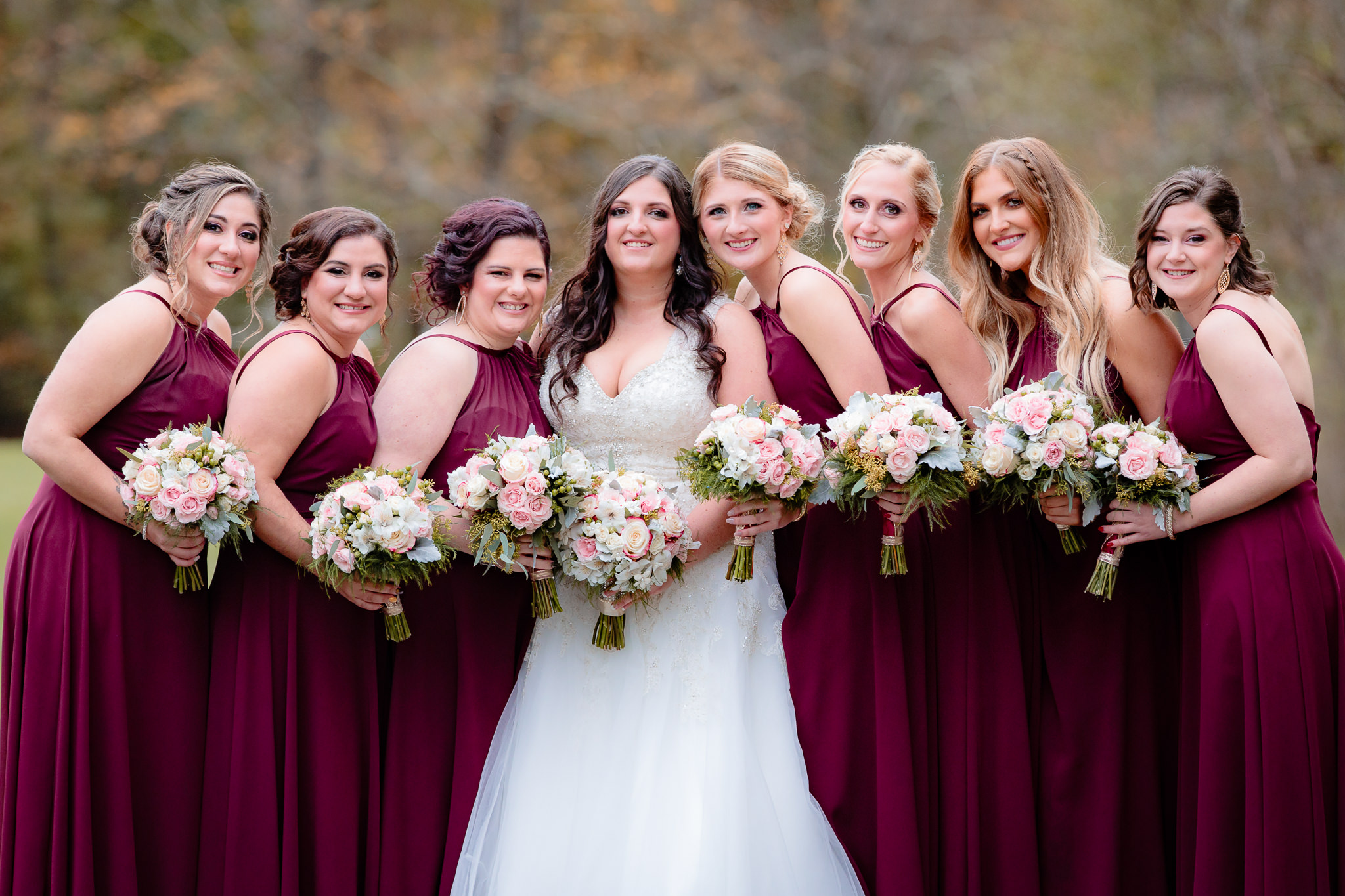 Bride with her bridesmaids in burgundy Christina Wu dresses