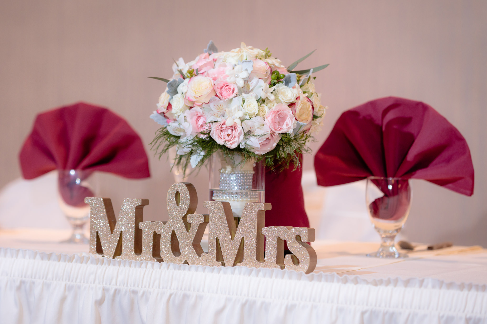 Mr. & Mrs. sign on the head table at the Fez