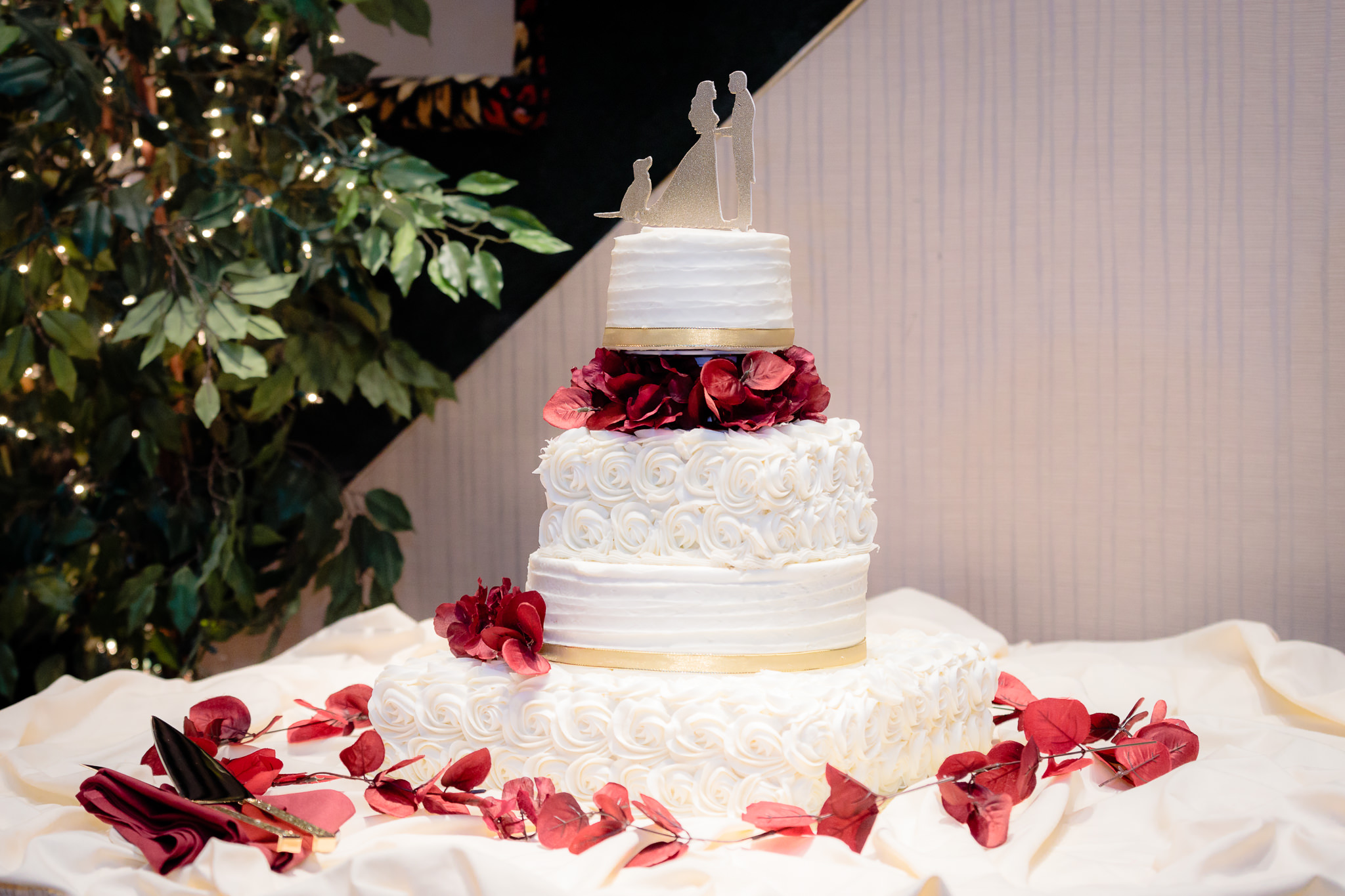 Wedding cake decorated with red fall leaves at the Fez