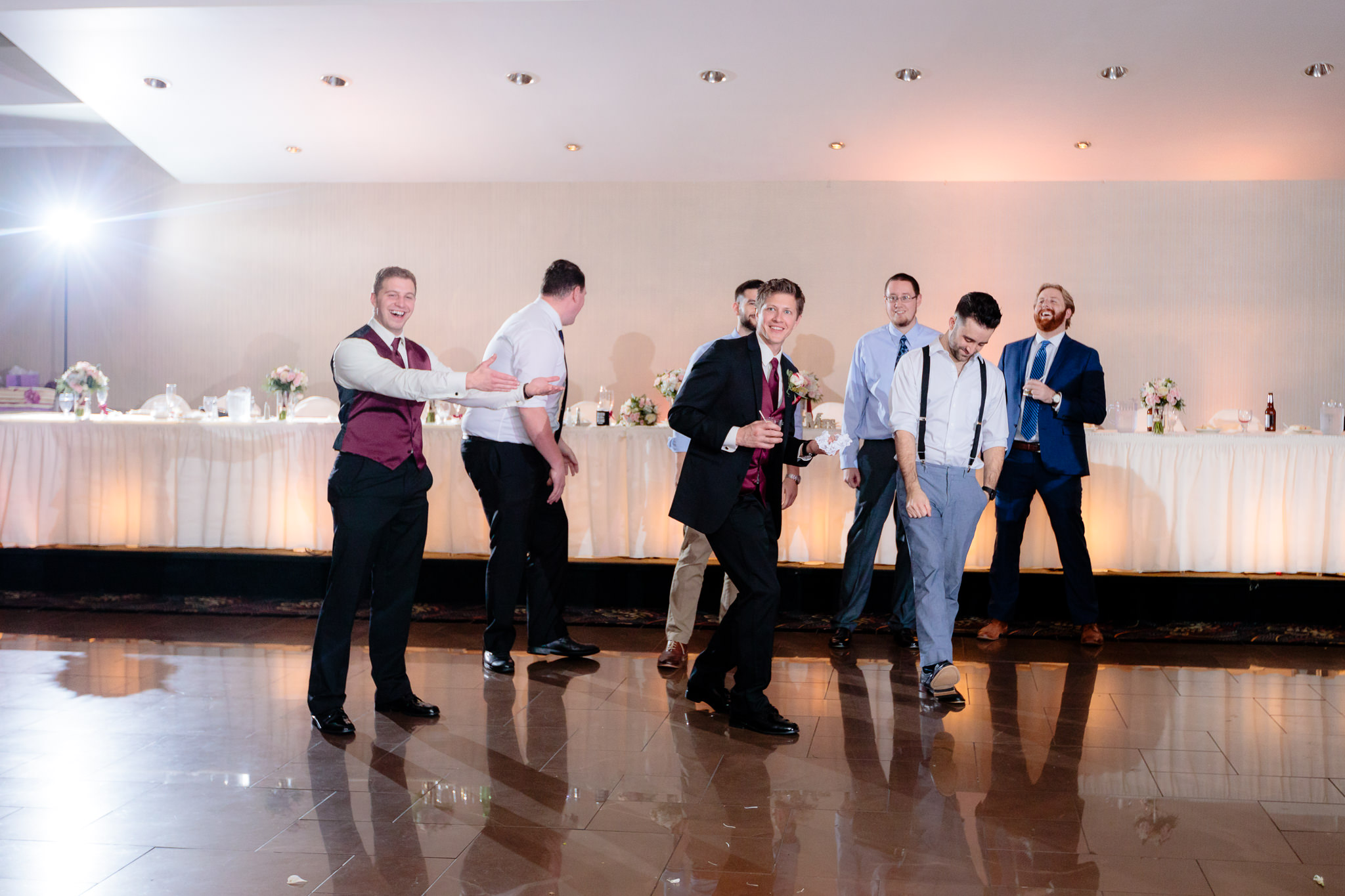 Best man catches the garter at a wedding at the Fez