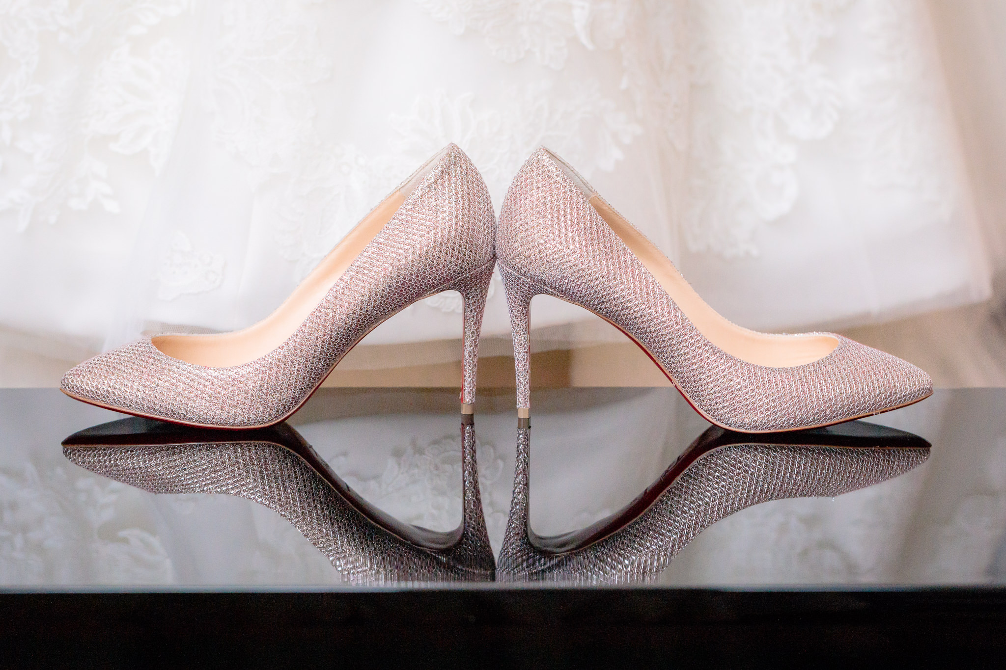 Gold Christian Louboutin heels for a Pittsburgh Hotel Monaco wedding