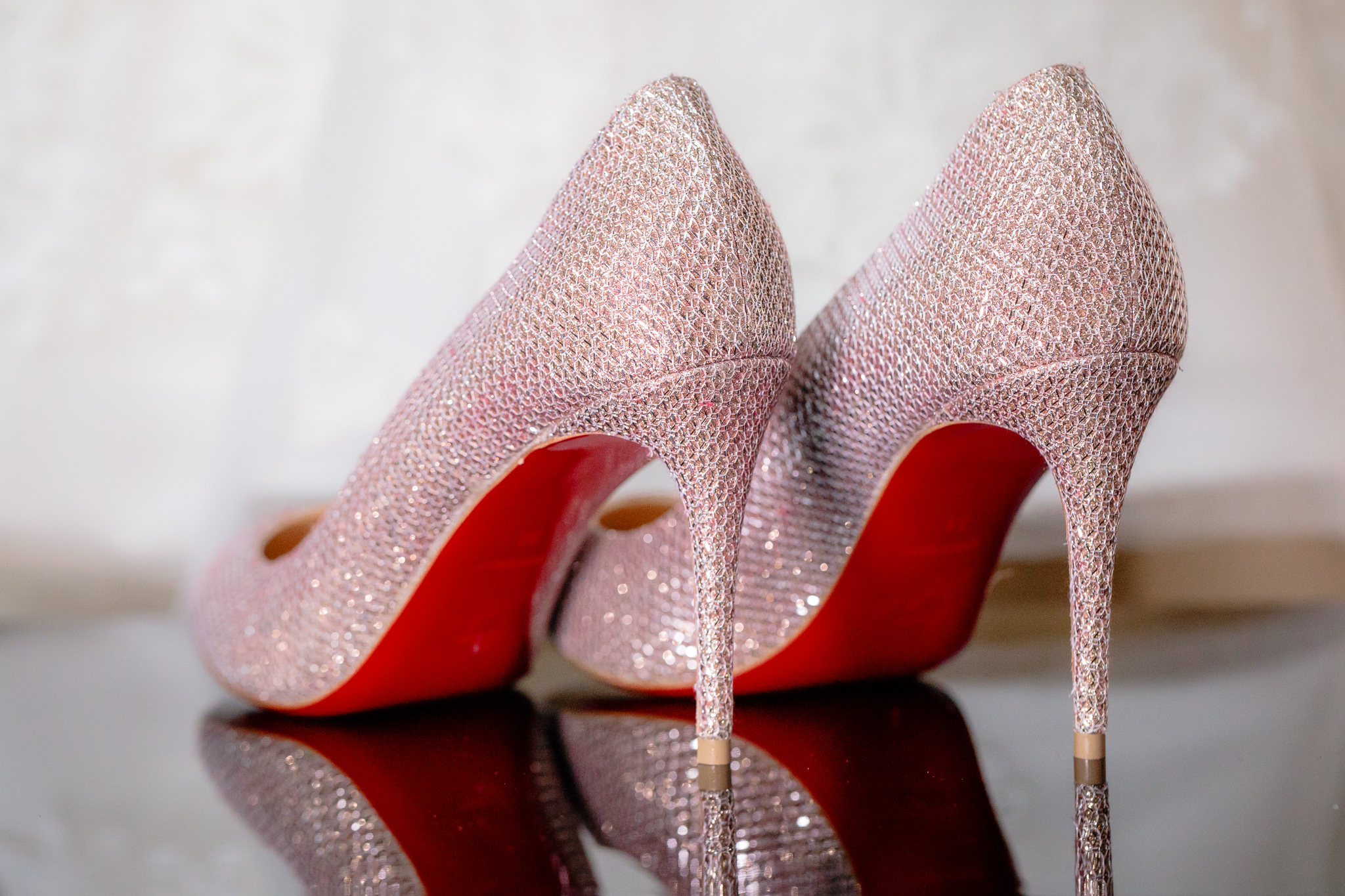 Red bottoms on Louboutin heels before a Hotel Monaco wedding in Pittsburgh PA