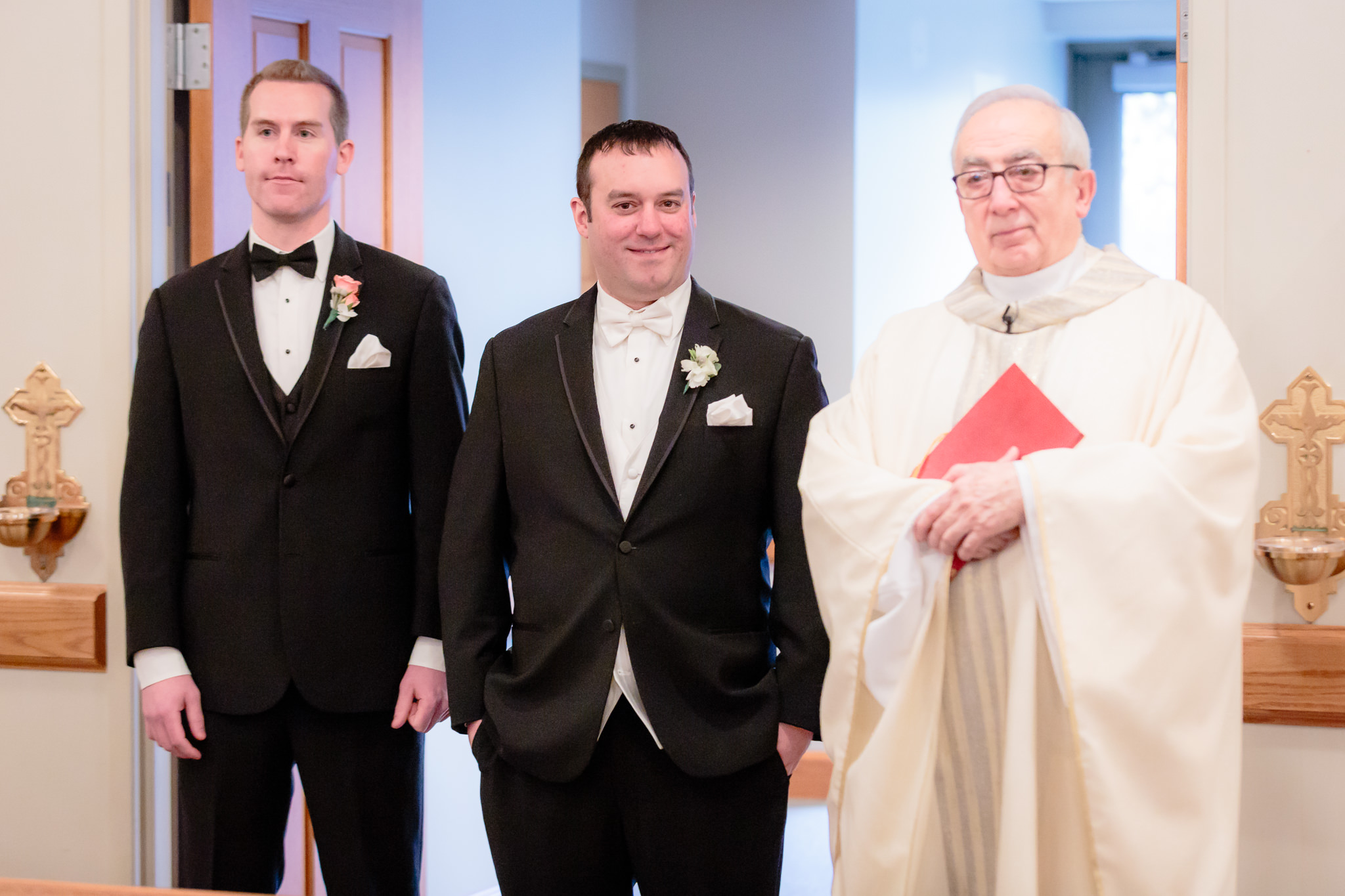 Groom and best man with the priest at a Mother of Sorrows Church wedding in Murrysville, PA