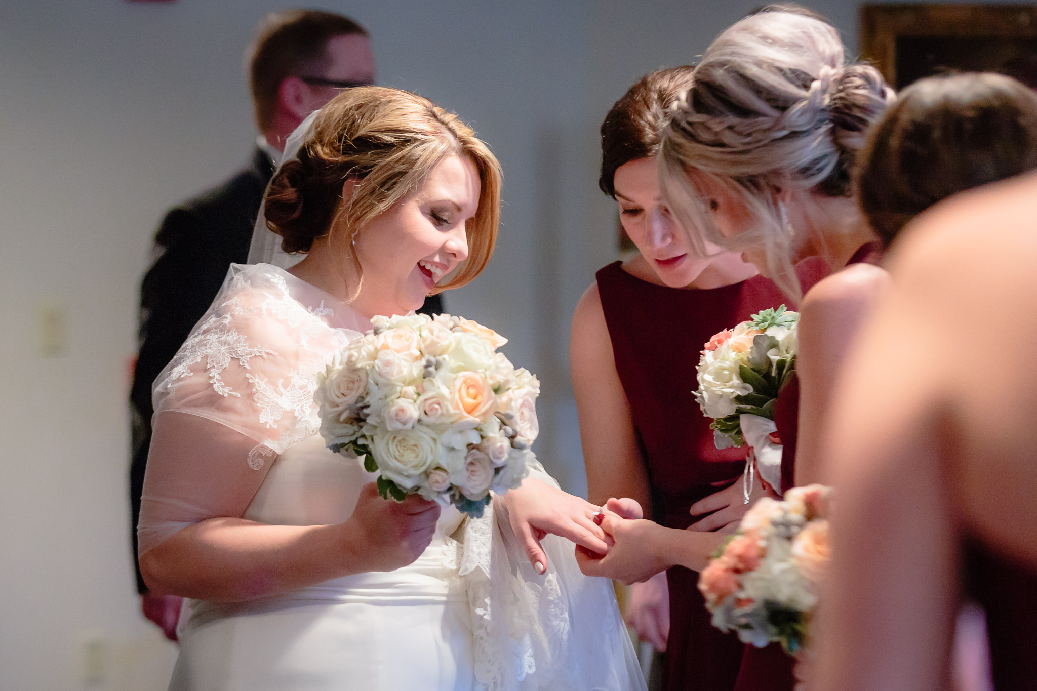 Bridesmaids admire bride's rings after her Mother of Sorrows Church wedding ceremony