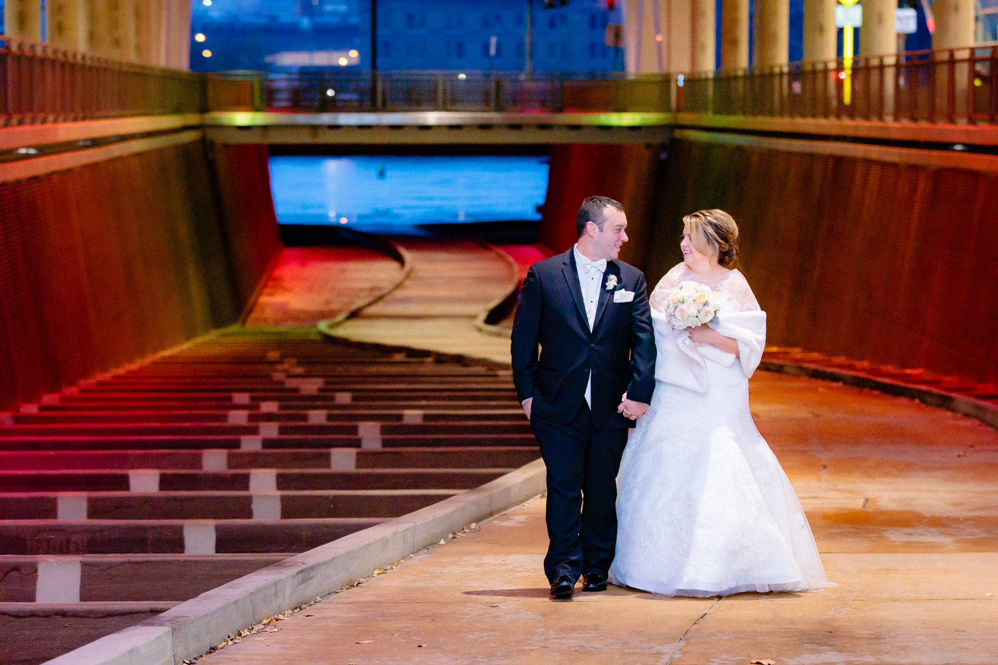 Newlyweds walk through the David L. Lawrence Convention Center walkway in Pittsburgh PA