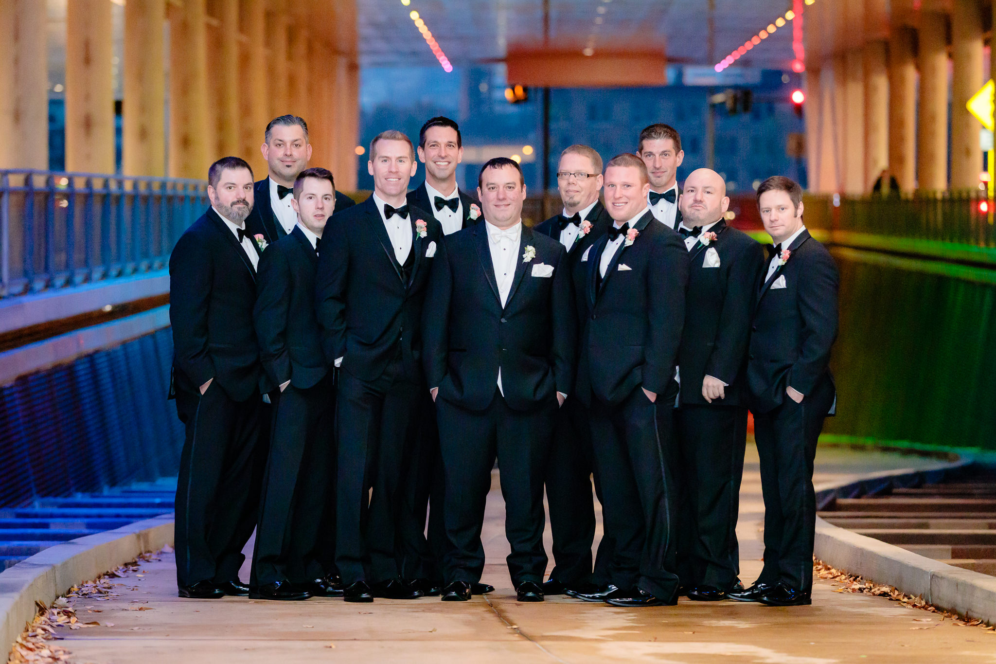 Groom with his groomsmen in black tuxedos at David L. Lawrence Convention Center