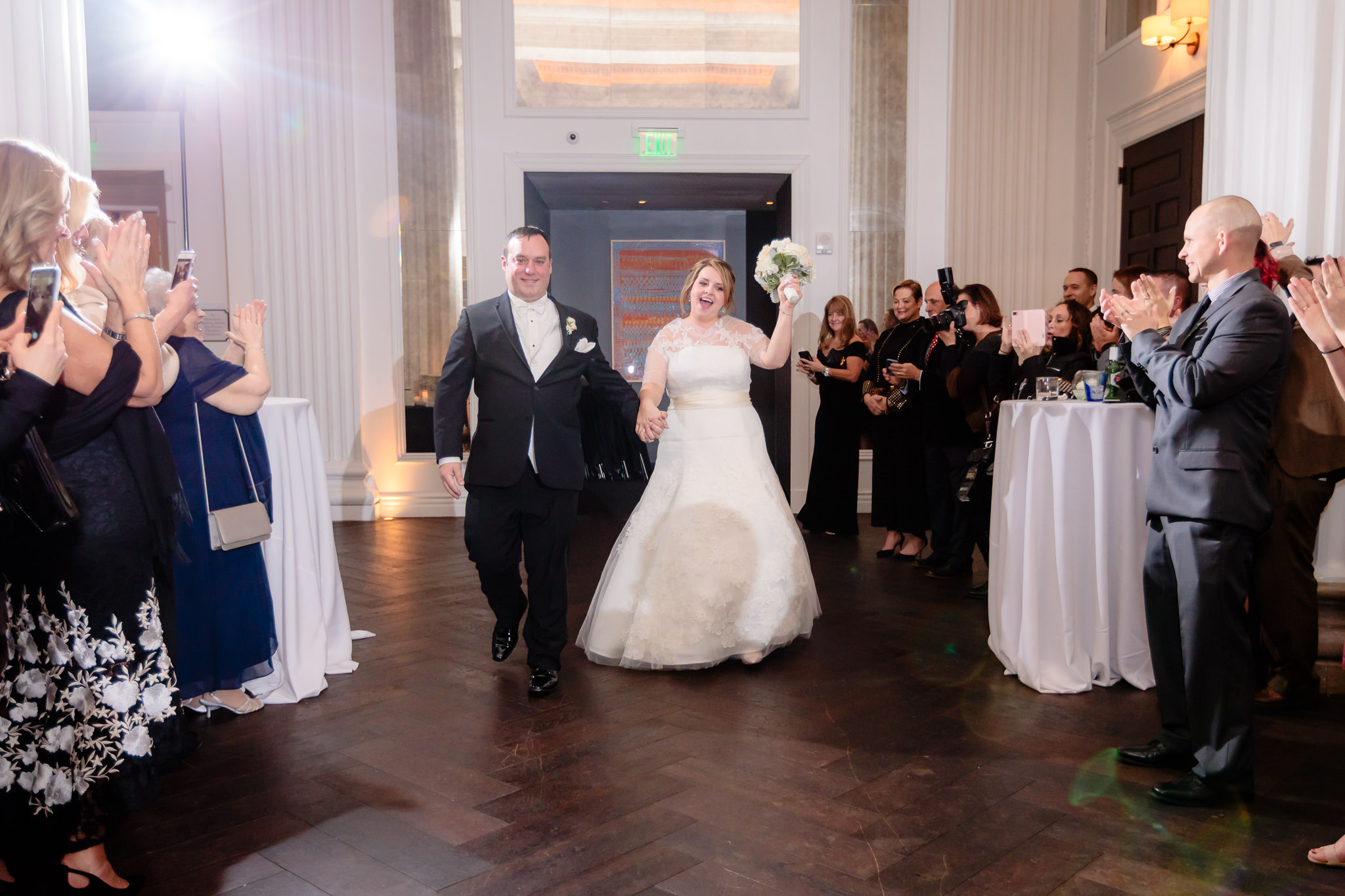 Newlyweds enter their reception at Hotel Monaco in downtown Pittsburgh