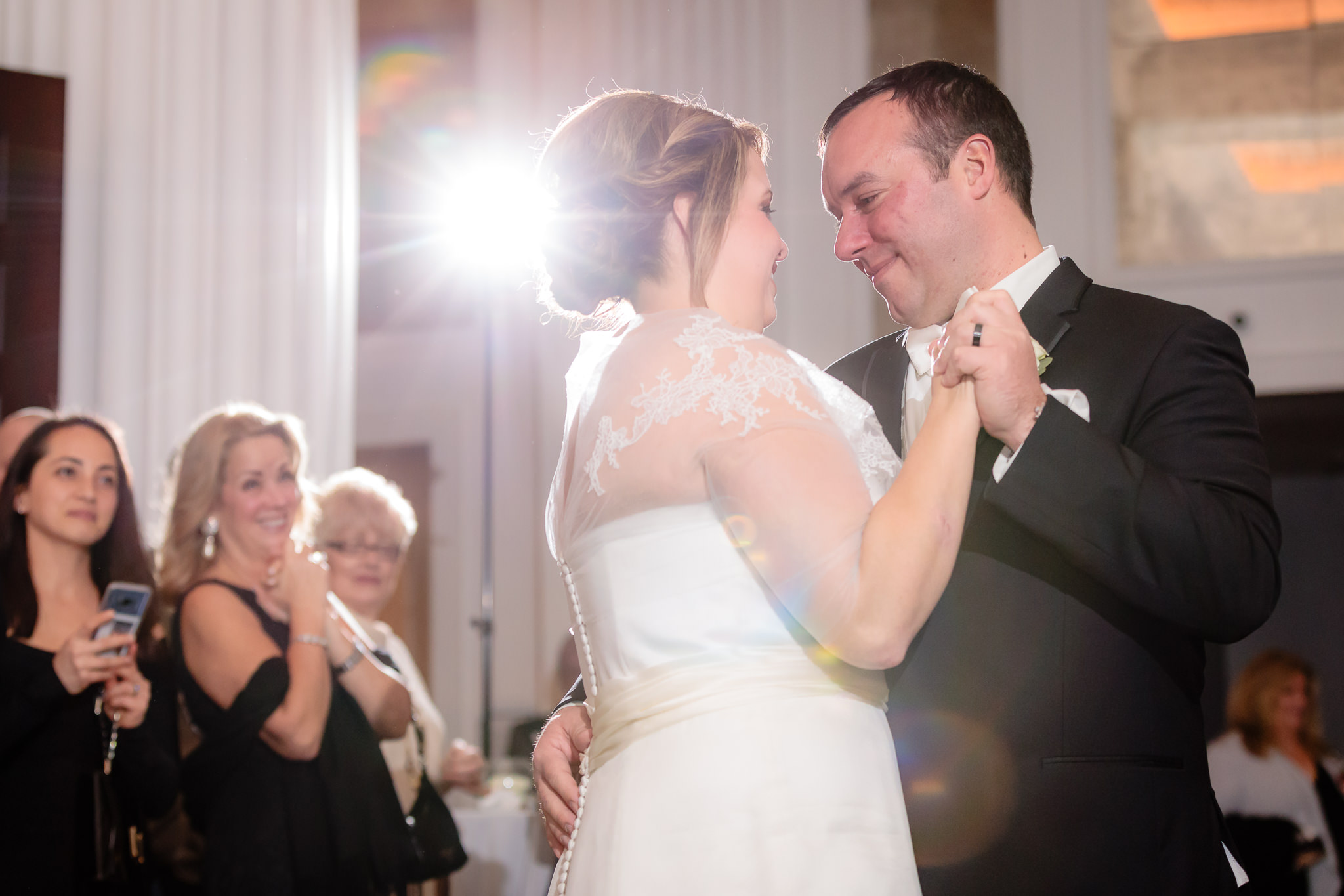 Guests smile as newlyweds share their first dance at Hotel Monaco in Pittsburgh