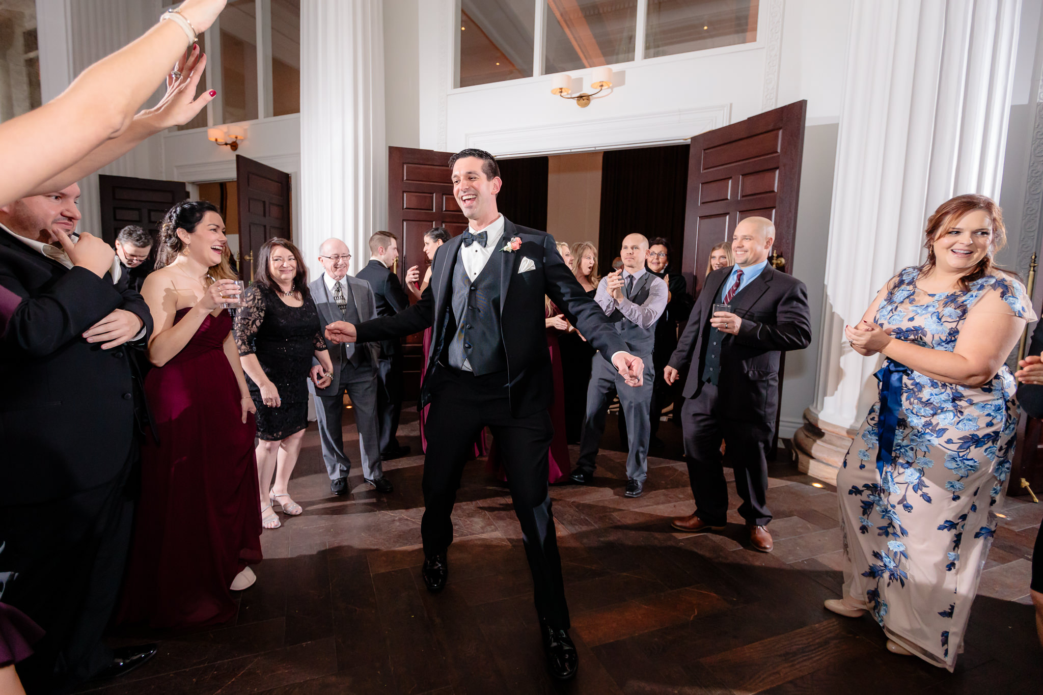 Groomsman dances at a wedding reception at Pittsburgh's Hotel Monaco