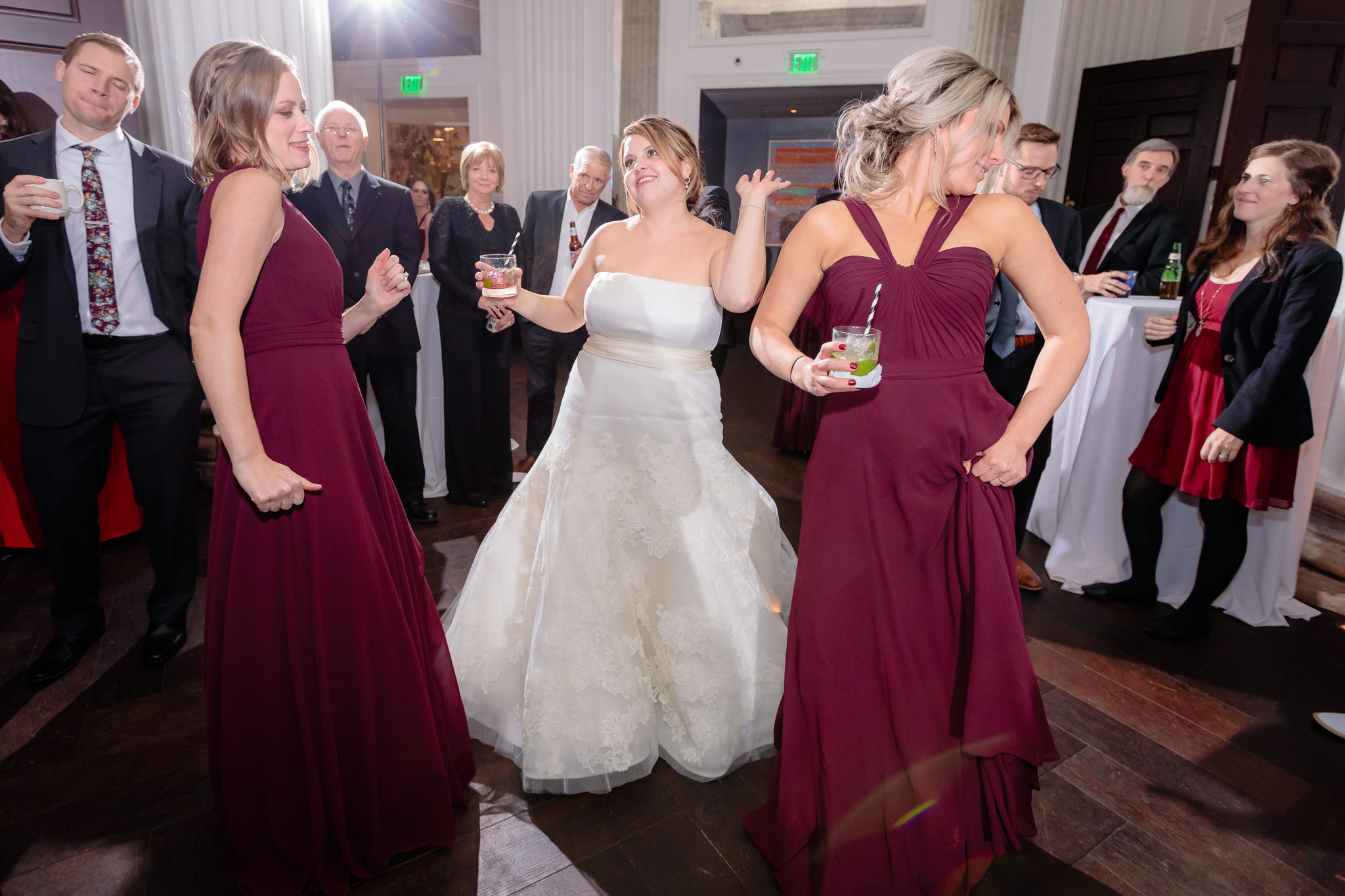 Bride dances with her bridesmaids at Pittsburgh's Hotel Monaco