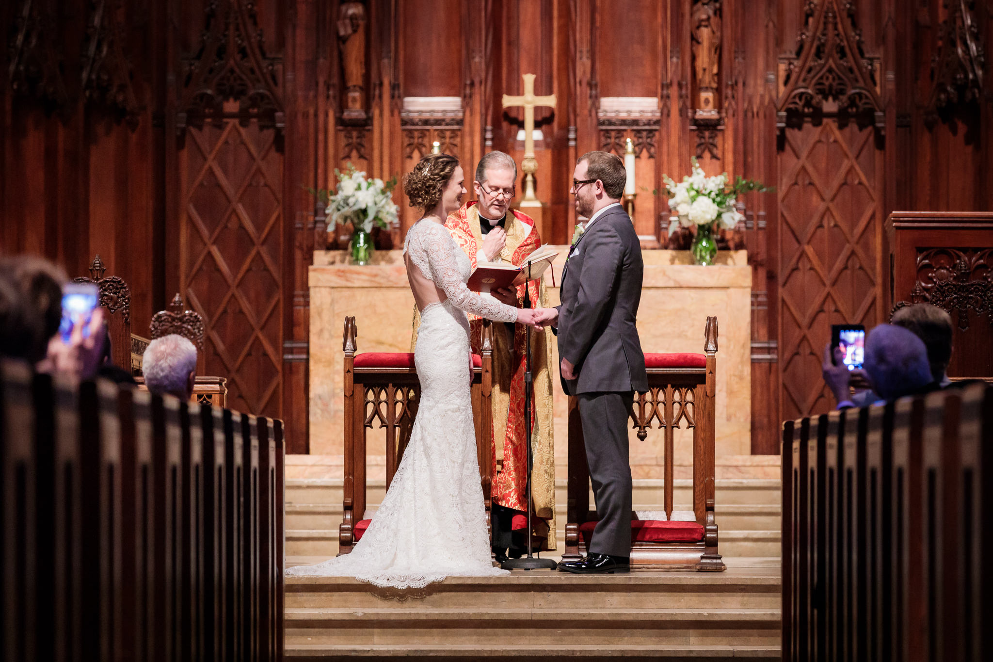 Bride and groom exchange vows at their Heinz Chapel wedding ceremony
