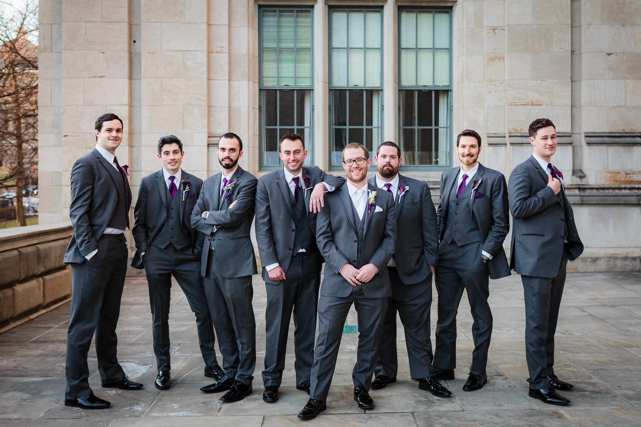 Groomsmen pose on the patio of the Cathedral of Learning in Pittsburgh