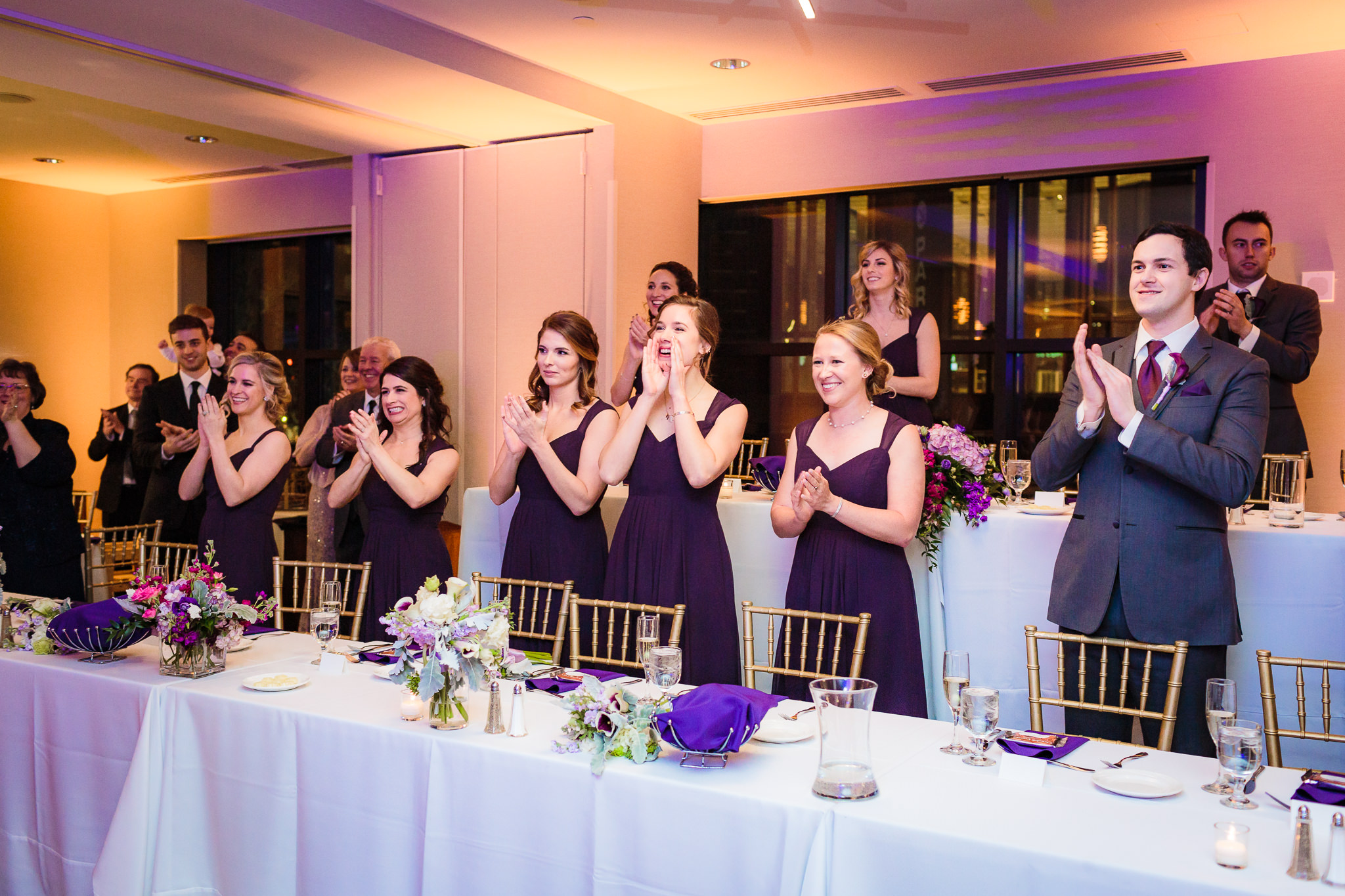 Bridal party cheers as the newlyweds enter their DoubleTree Pittsburgh Downtown reception