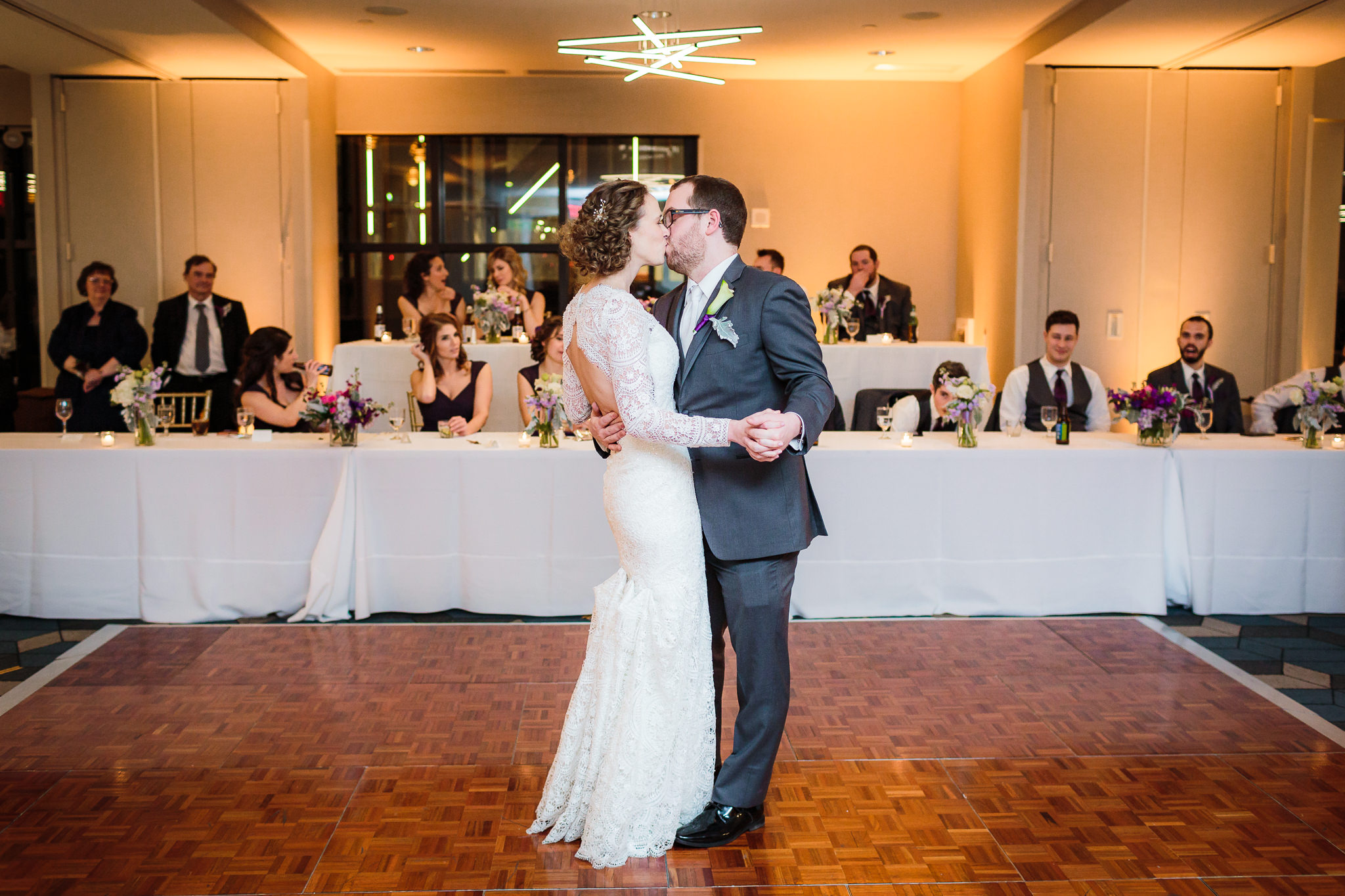 Newlyweds kiss during their first dance at the DoubleTree Pittsburgh Downtown