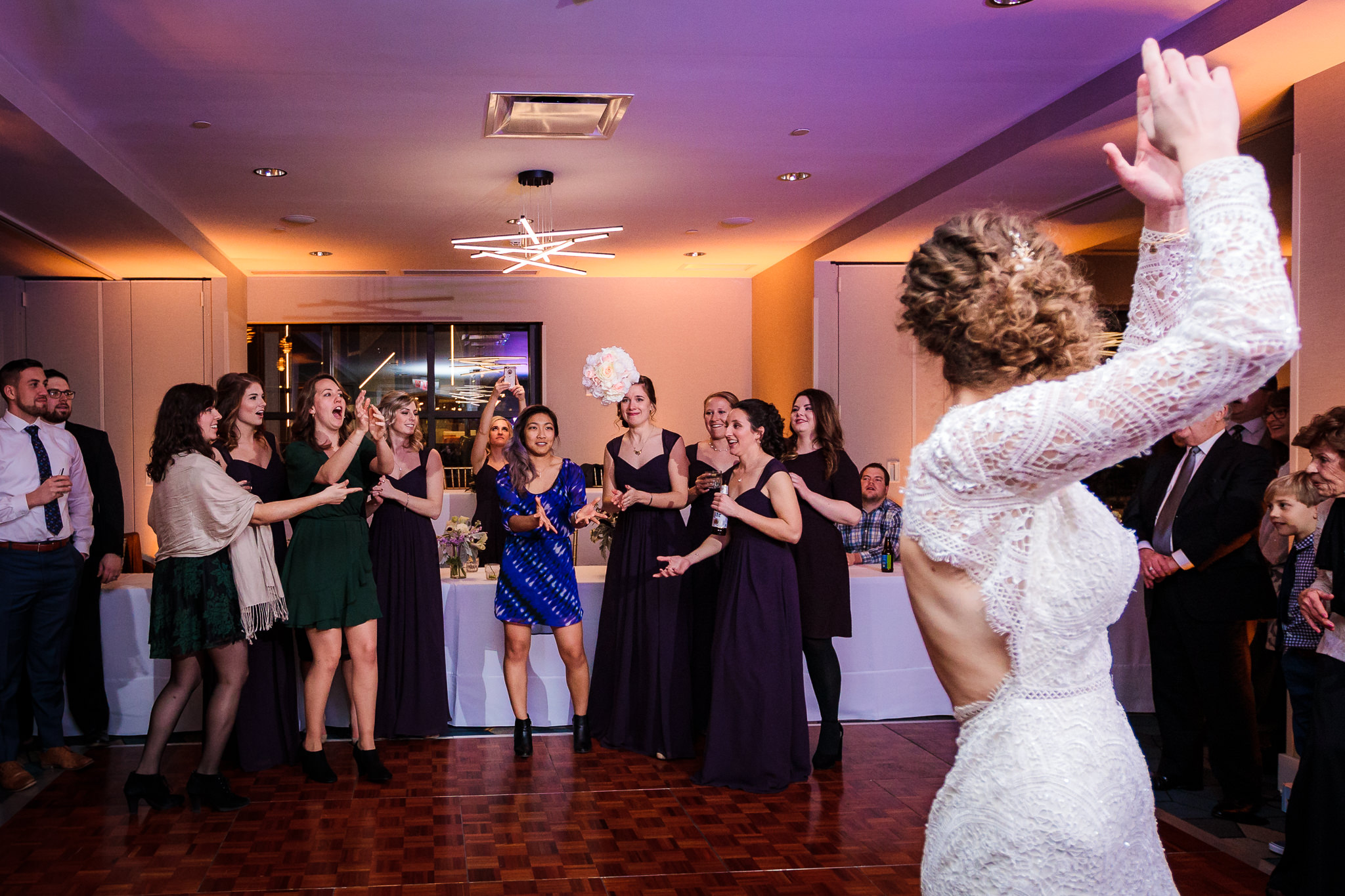 Bride tosses her bouquet at a DoubleTree Pittsburgh Downtown reception
